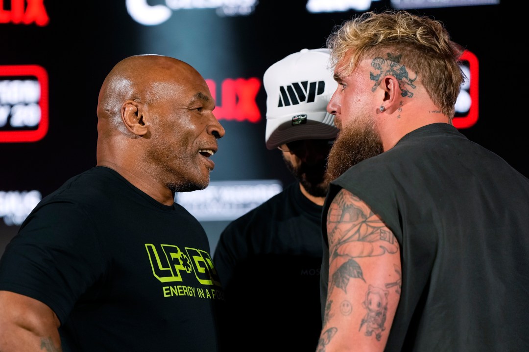 Mike Tyson and Jake Paul face off during a news conference