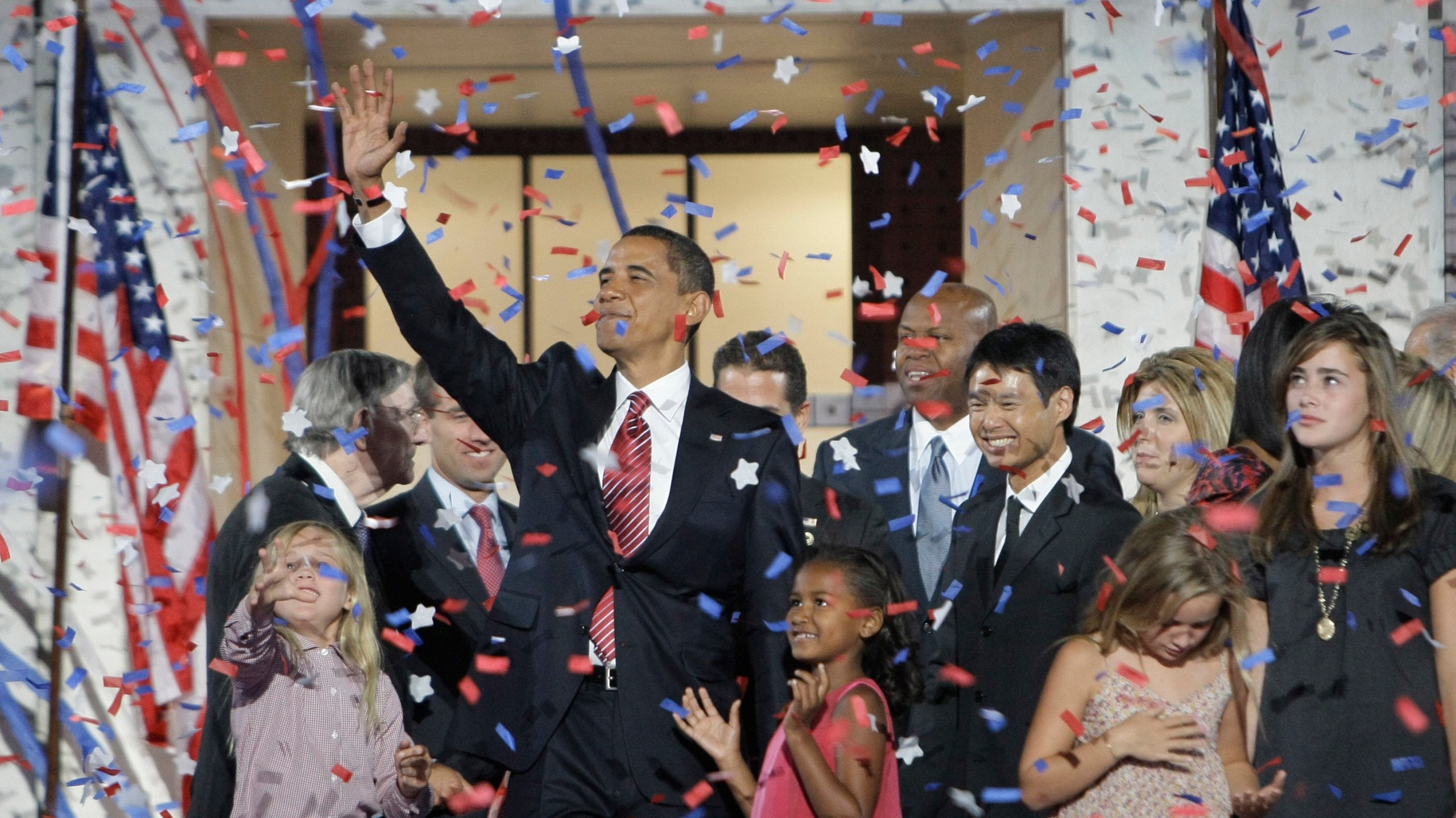 FILE - Democratic presidential candidate Sen. Barack Obama, D-Ill., waves with his family and his running mate's family after his acceptance speech at the Democratic National Convention at Invesco Field at Mile High in Denver, Aug. 28, 2008.(AP Photo/Alex Brandon, File)