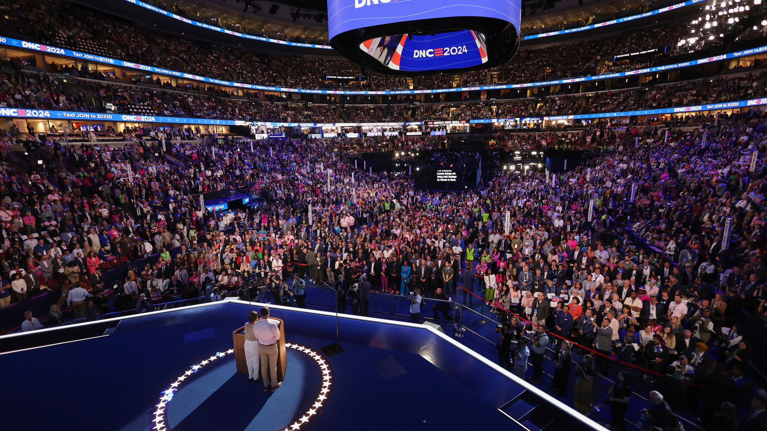 Jon Polin and Rachel Goldberg, parents of Hersh Goldberg-Polin who is being held hostage in Gaza, appear on stage on the third day of the Democratic National Convention in Chicago,Wednesday, Aug. 21, 2024. (Mike Segar/Pool via AP)