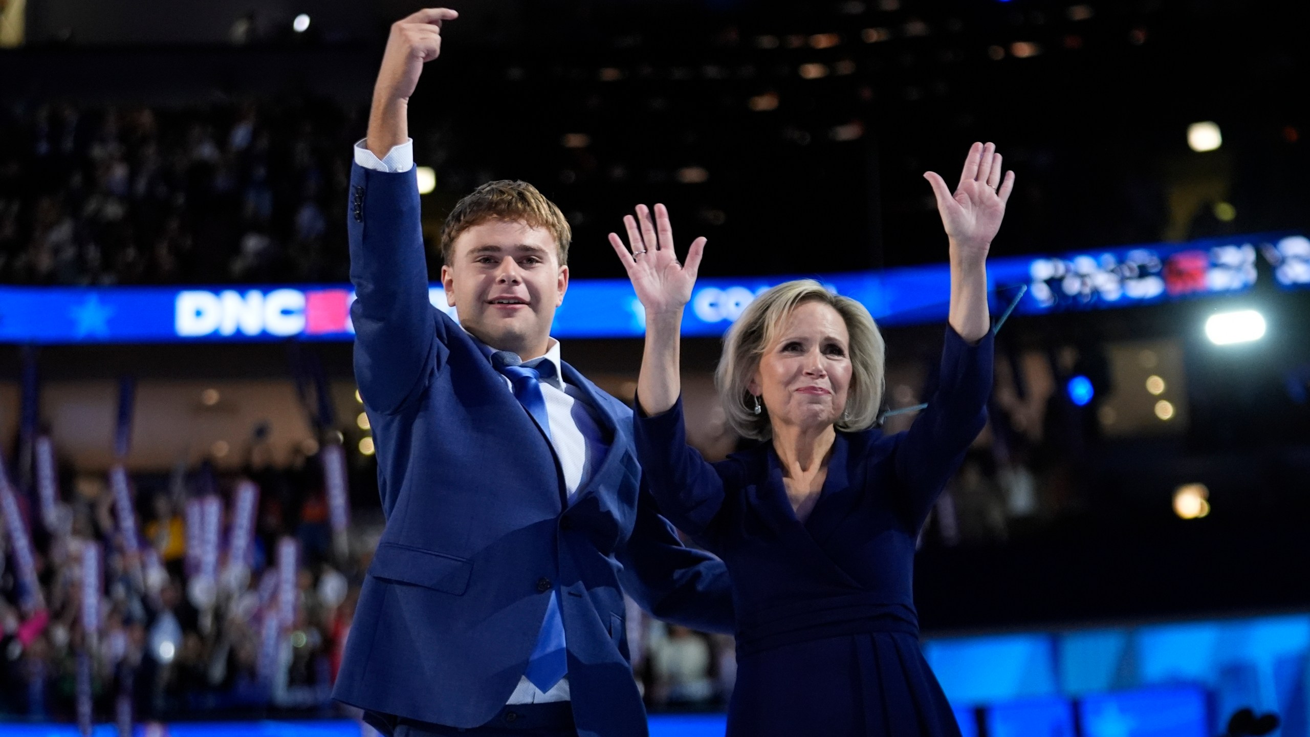 Democratic vice presidential nominee Minnesota Gov. Tim Walz's son Gus and wife Gwen react during the Democratic National Convention Wednesday, Aug. 21, 2024, in Chicago. (AP Photo/Paul Sancya)