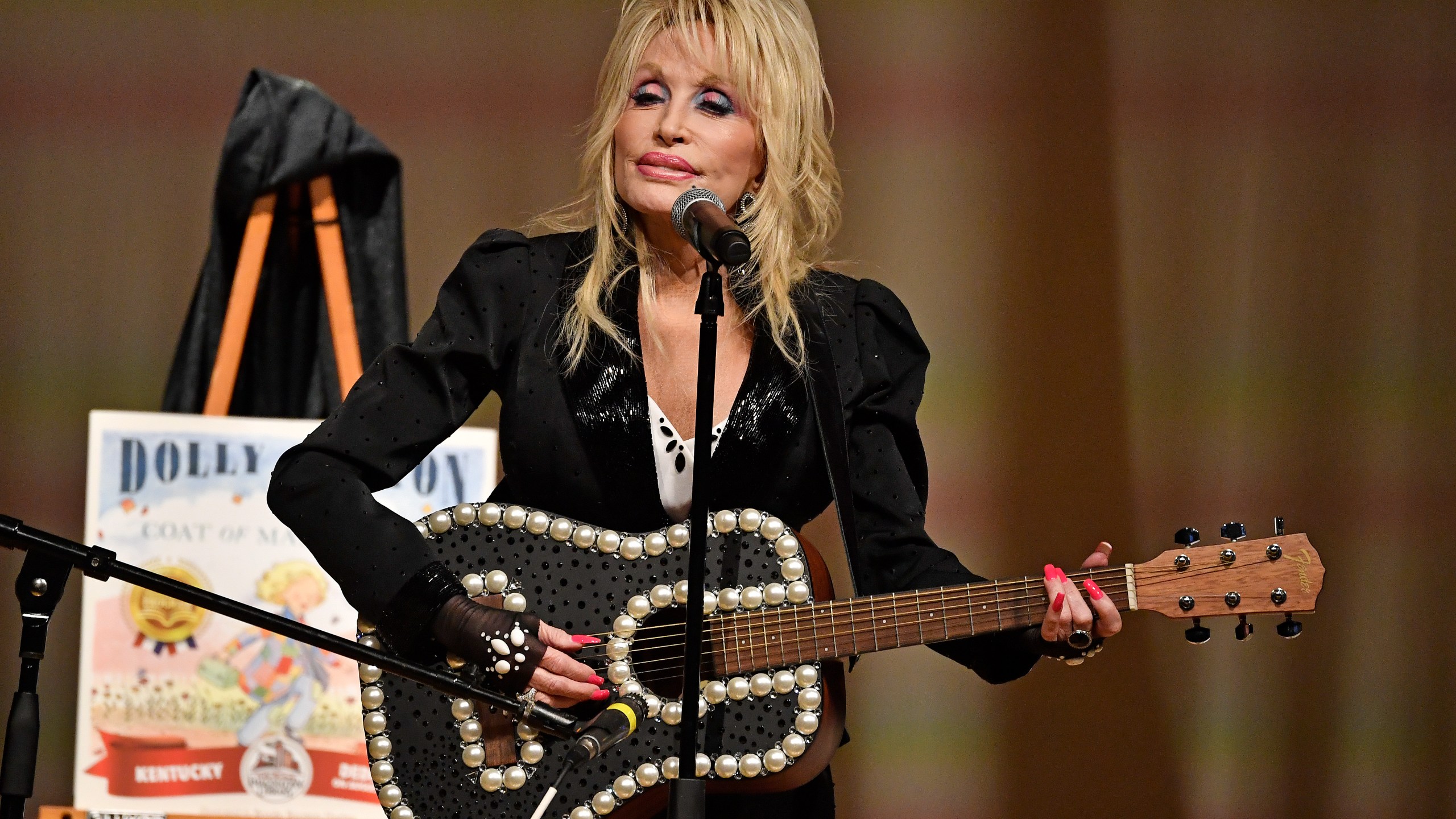 Dolly Parton performs onstage