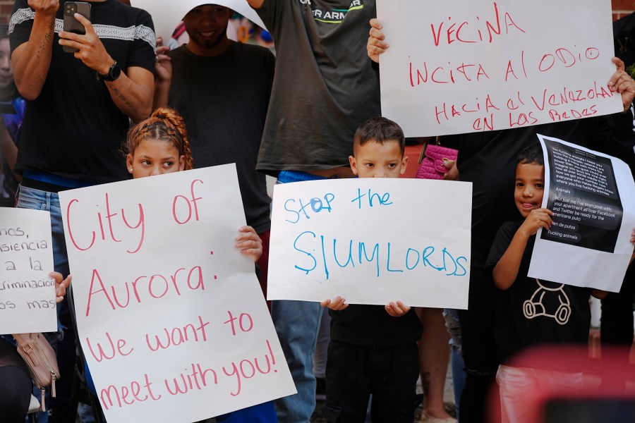 Residents hold up placards in Aurora, Colorado.