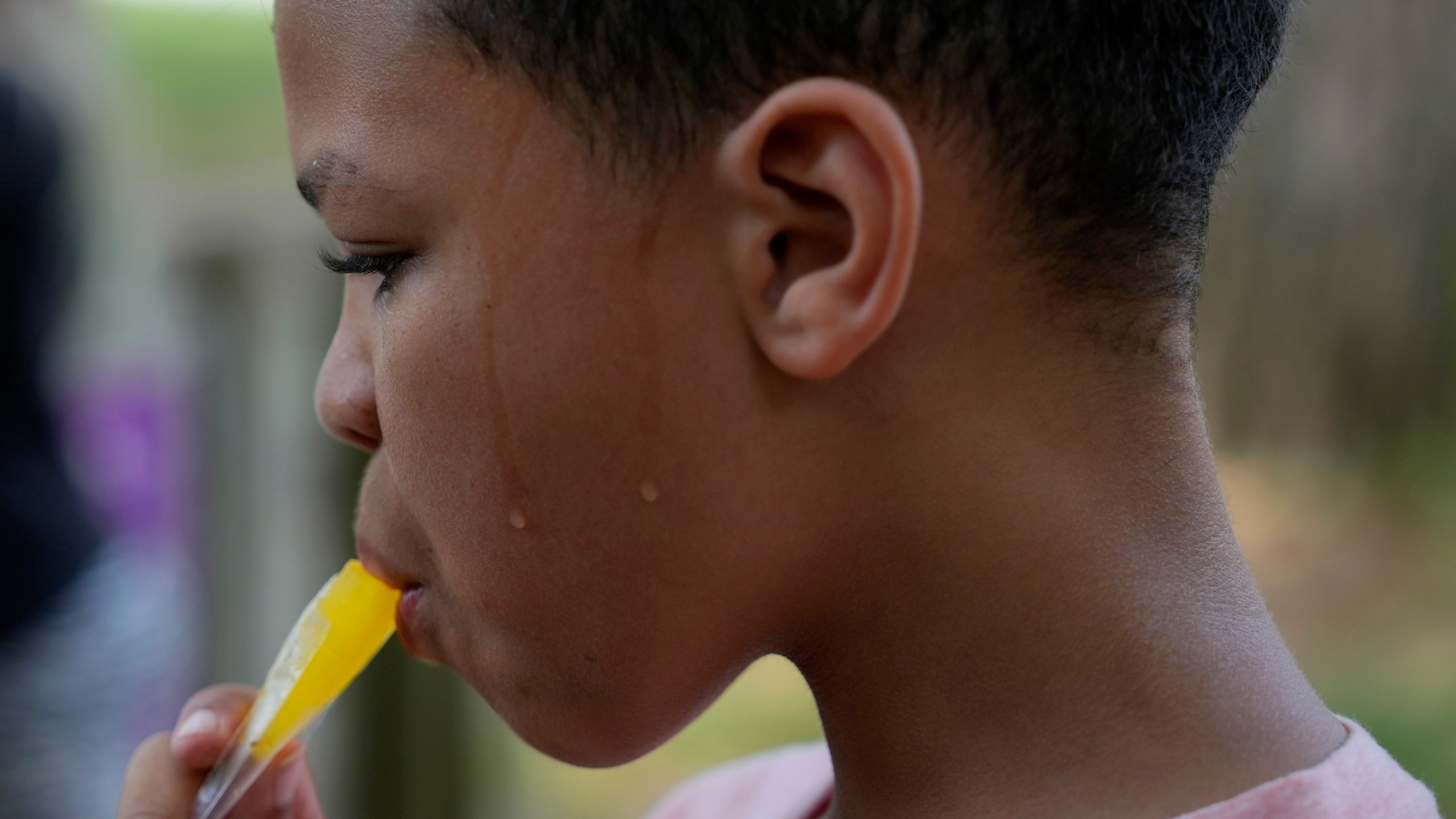 FILE - Zariah Fields eats a popsicle, June 20, 2024, at YMCA Camp Kern in Oregonia, Ohio. (AP Photo/Joshua A. Bickel, File)