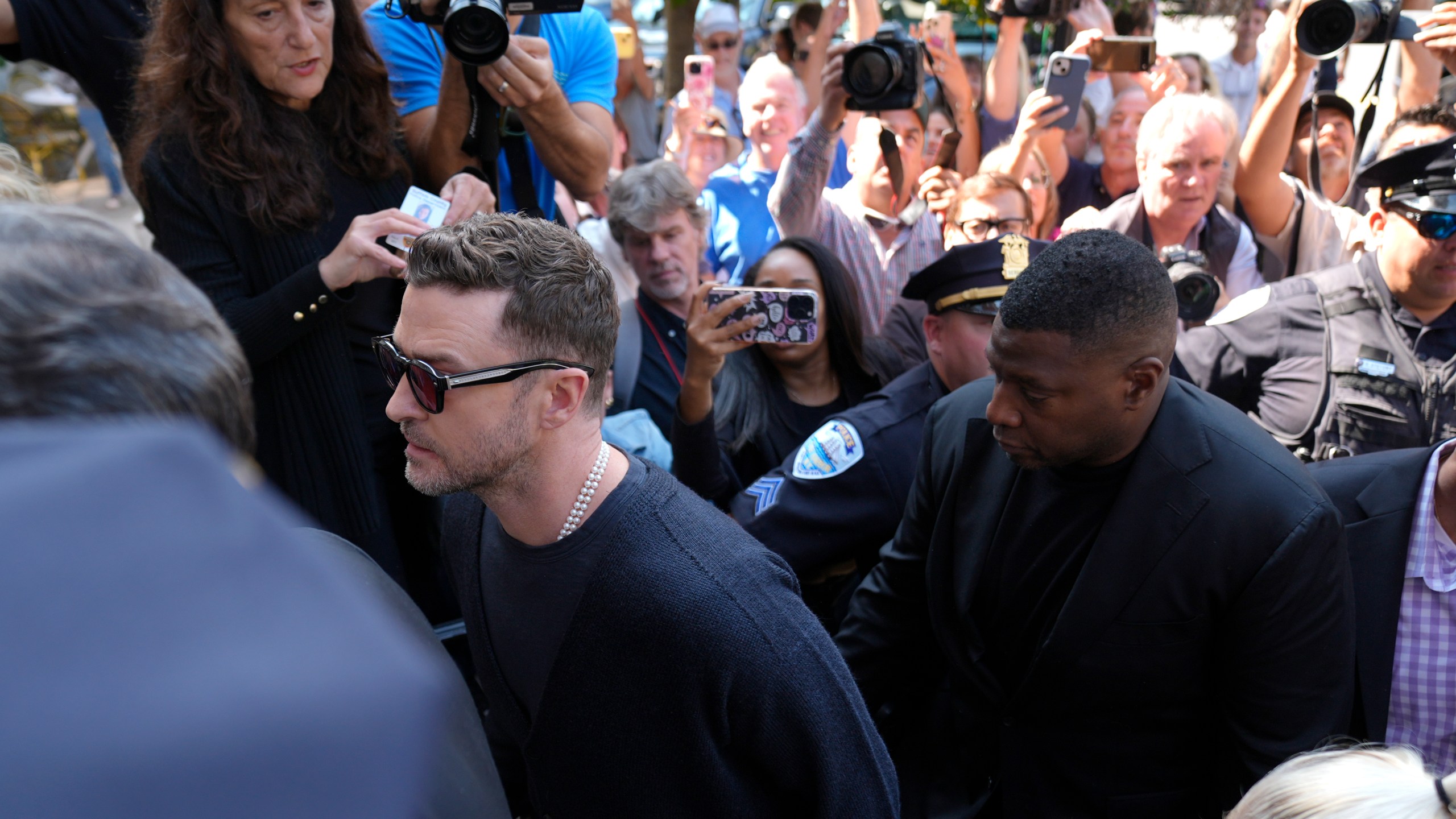 Justin Timberlake, left, walks into court for a hearing, Friday, Sept. 13, 2024, in Sag Harbor, N.Y. (AP Photo/Pamela Smith)