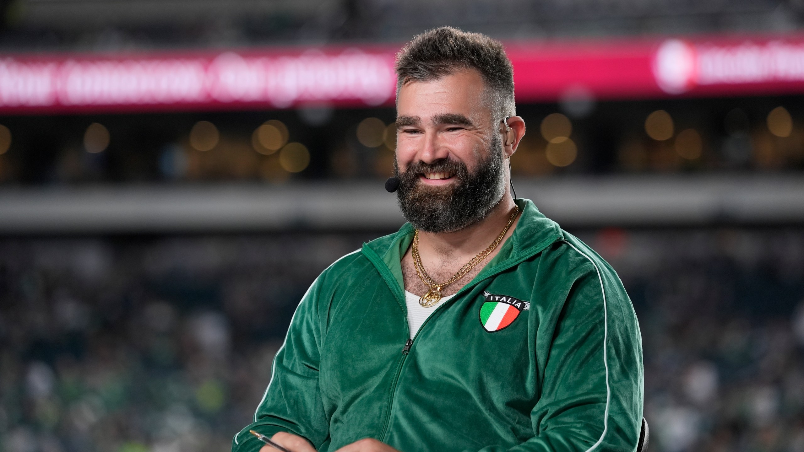 Former Philadelphia Eagles player Jason Kelce sits on the NFL ESPN Monday Night Football before an NFL football game between the Eagles and the Atlanta Falcons on Monday, Sept. 16, 2024, in Philadelphia. (AP Photo/Matt Rourke)