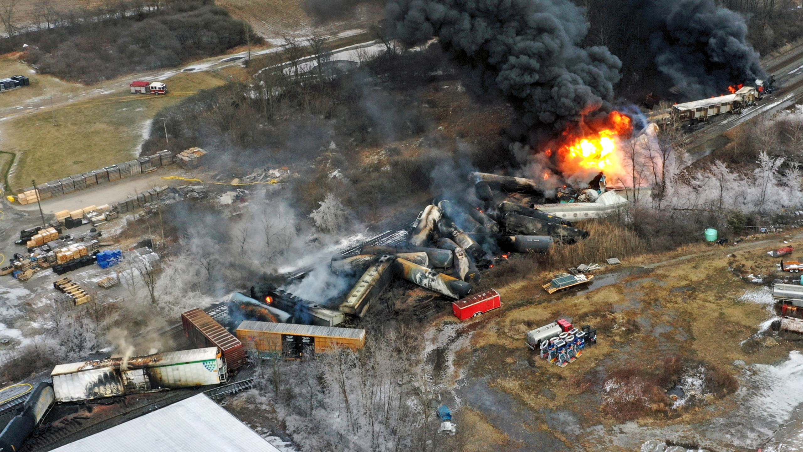 In this photo, portions of a Norfolk Southern freight train that derailed the previous night in East Palestine, Ohio, are on fire.