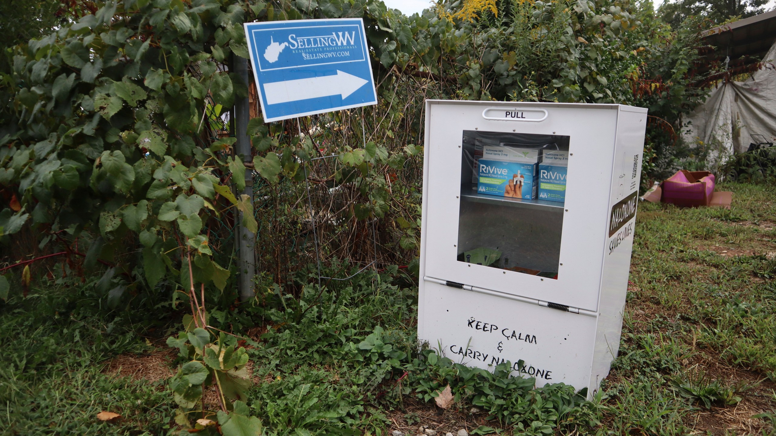 A new naloxone distribution box sits in a residential neighborhood in Hurricane, W.Va. on Tuesday, Sept. 24, 2024. (AP Photo/Leah Willingham)
