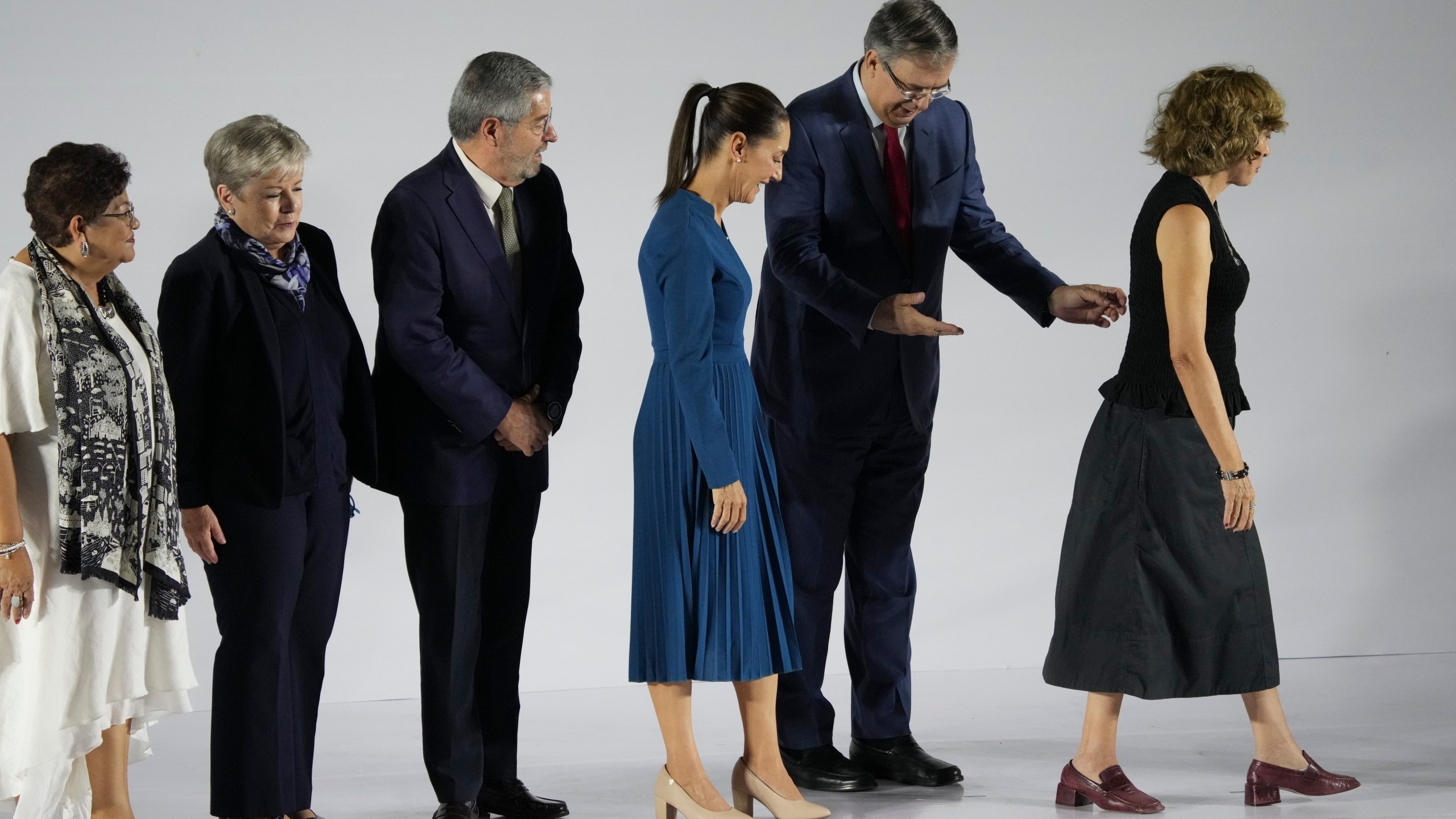 FILE - Ernestina Godoy, legal advisor, from left, Alicia Bárcena, secretary of environment and natural resources, Juan Ramón de la Fuente, foreign affairs secretary, incoming President Claudia Sheinbaum, Marcelo Ebrard, economy secretary and Rosaura Ruiz, appointed to a new ministry overseeing science, humanities, technology and innovation, leave a press conference where Sheinbaum presented six members of her Cabinet, in Mexico City, June 20, 2024. (AP Photo/Marco Ugarte, File)