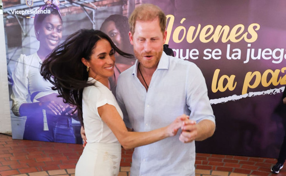 Harry and Meghan dancing at an event