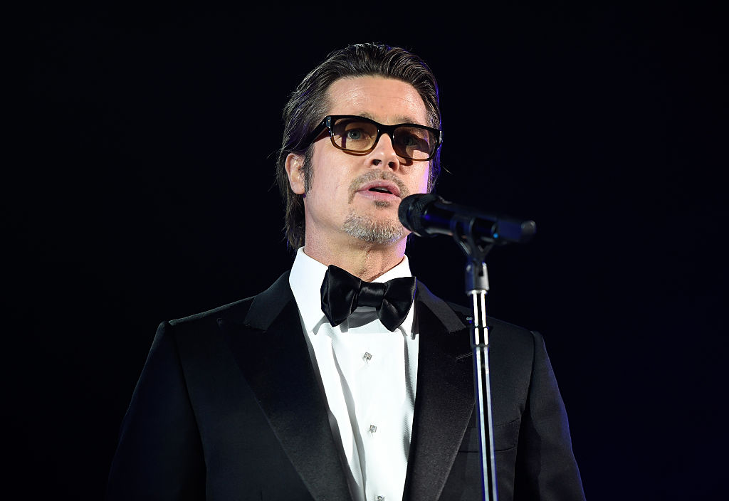Brad Pitt in front of microphone