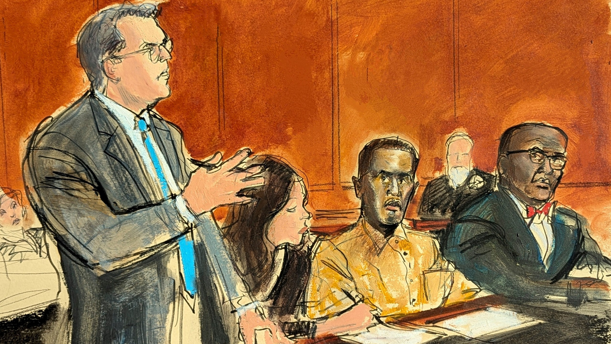 Courtroom sketch of Sean "Diddy" Combs' defense attorney Marc Agnifilo, left, addressing the judge while Combs, seated second from right, in prison uniform, watches