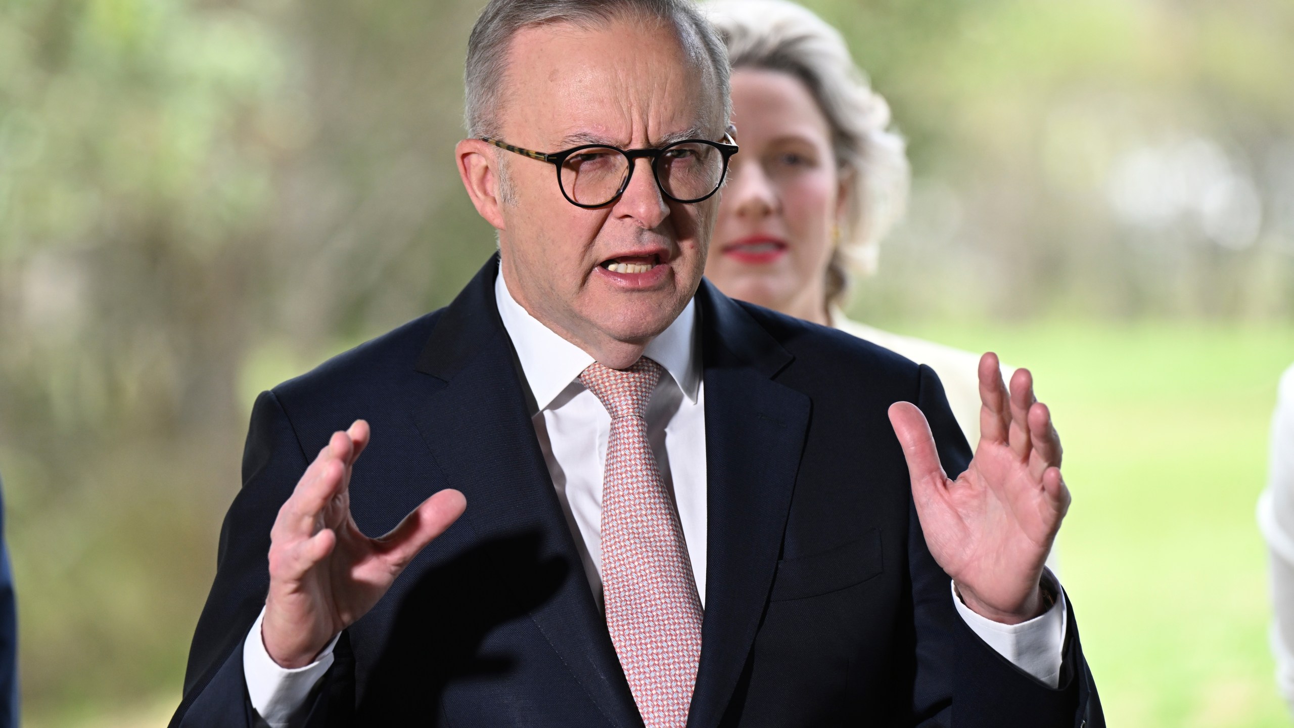 Australian Prime Minister Anthony Albanese speaks at a podium