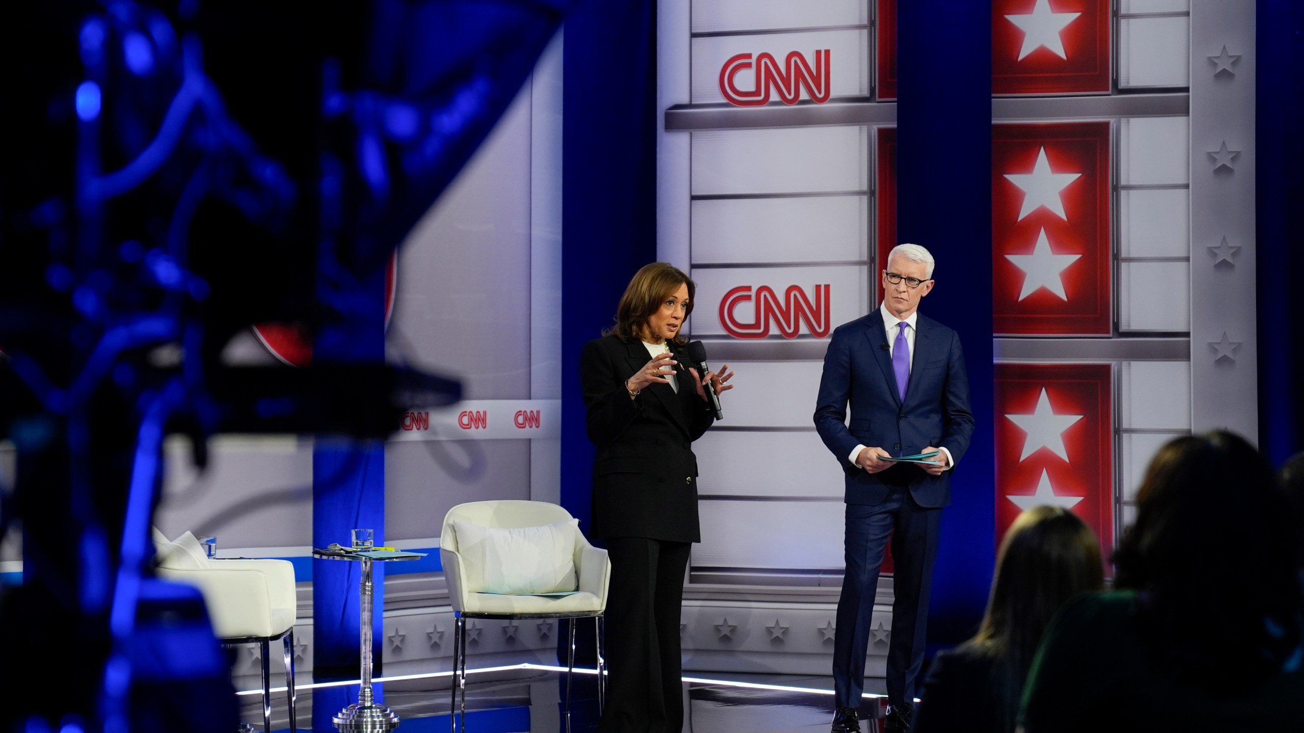 Democratic presidential nominee Vice President Kamala Harris speaks during a CNN town hall in Aston, Pa., Wednesday, Oct. 23, 2024, as moderator Anderson Cooper listens. (AP Photo/Matt Rourke)