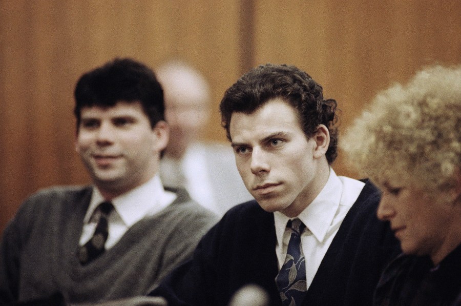 FILE - Lyle, left, and Erik Menendez sit with defense attorney Leslie Abramson in 1990.