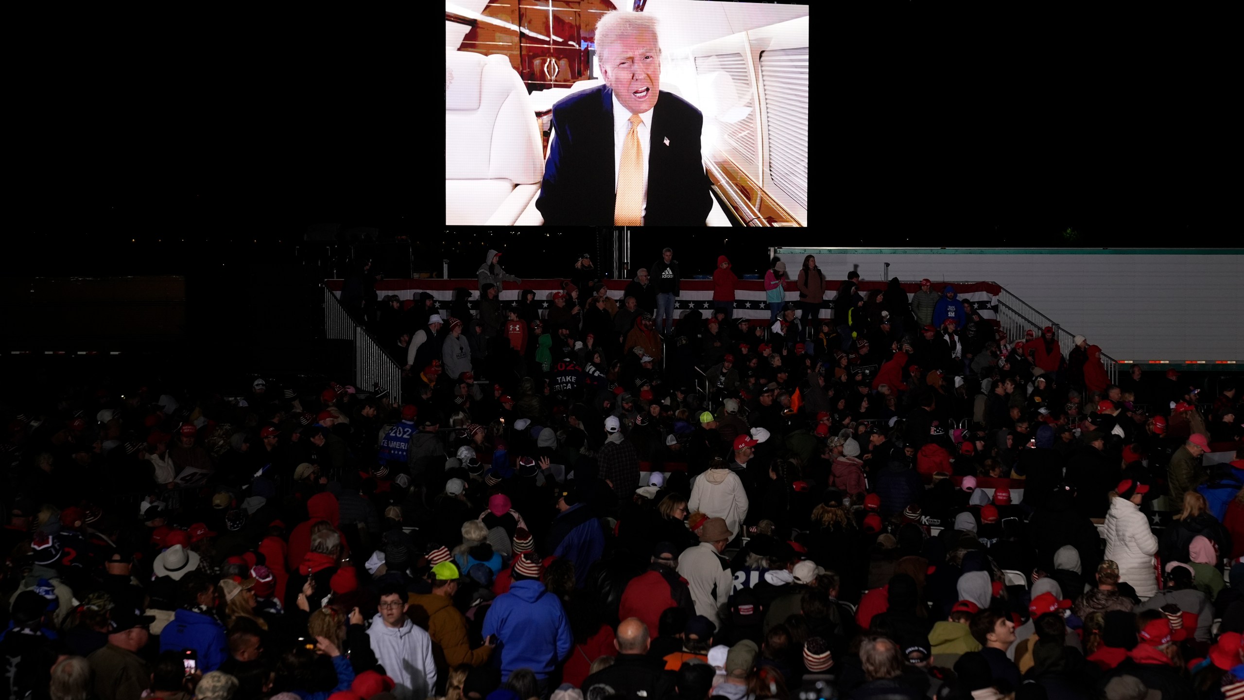 A video message from Republican presidential nominee former President Donald Trump is played at a campaign event Friday, Oct. 25, 2024, in Traverse City, Mich. (AP Photo/Paul Sancya)