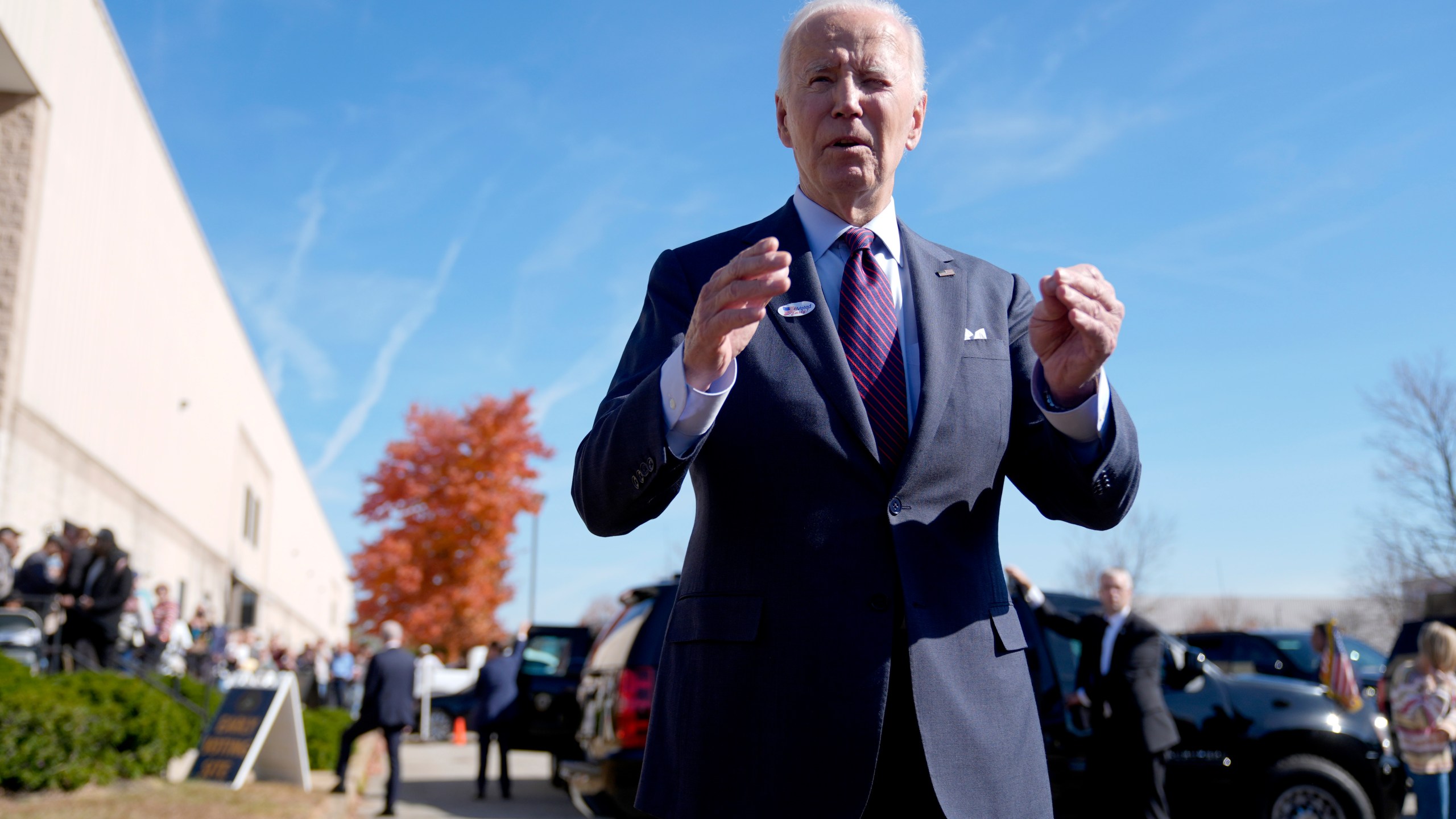 President Joe Biden speaks with reporters after casting his early-voting ballot for the 2024 general elections, Monday, Oct. 28, 2024, at a polling station in New Castle, Del. (AP Photo/Manuel Balce Ceneta)