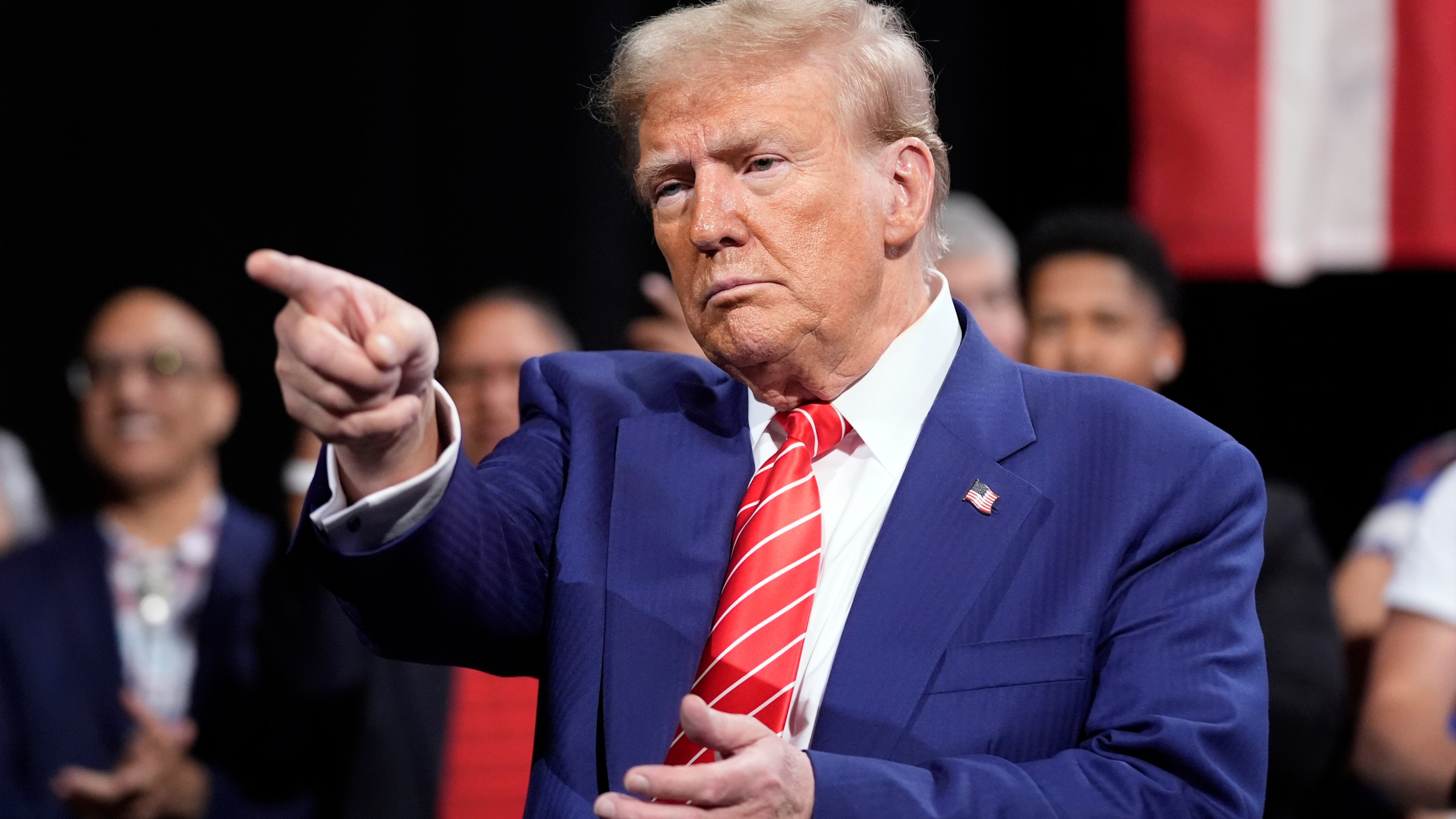 Republican presidential nominee former President Donald Trump gestures at a campaign event at the Cobb Energy Performing Arts Centre