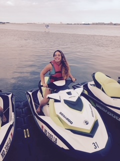 A young woman on a wave runner.