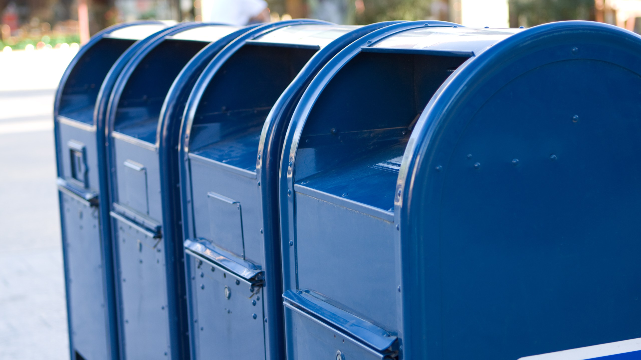 A row of blue mailboxes.