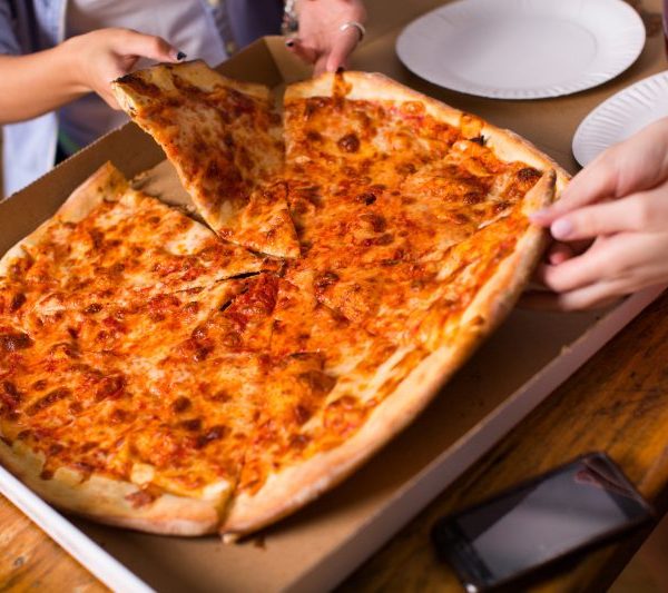 An image of people sharing a pizza