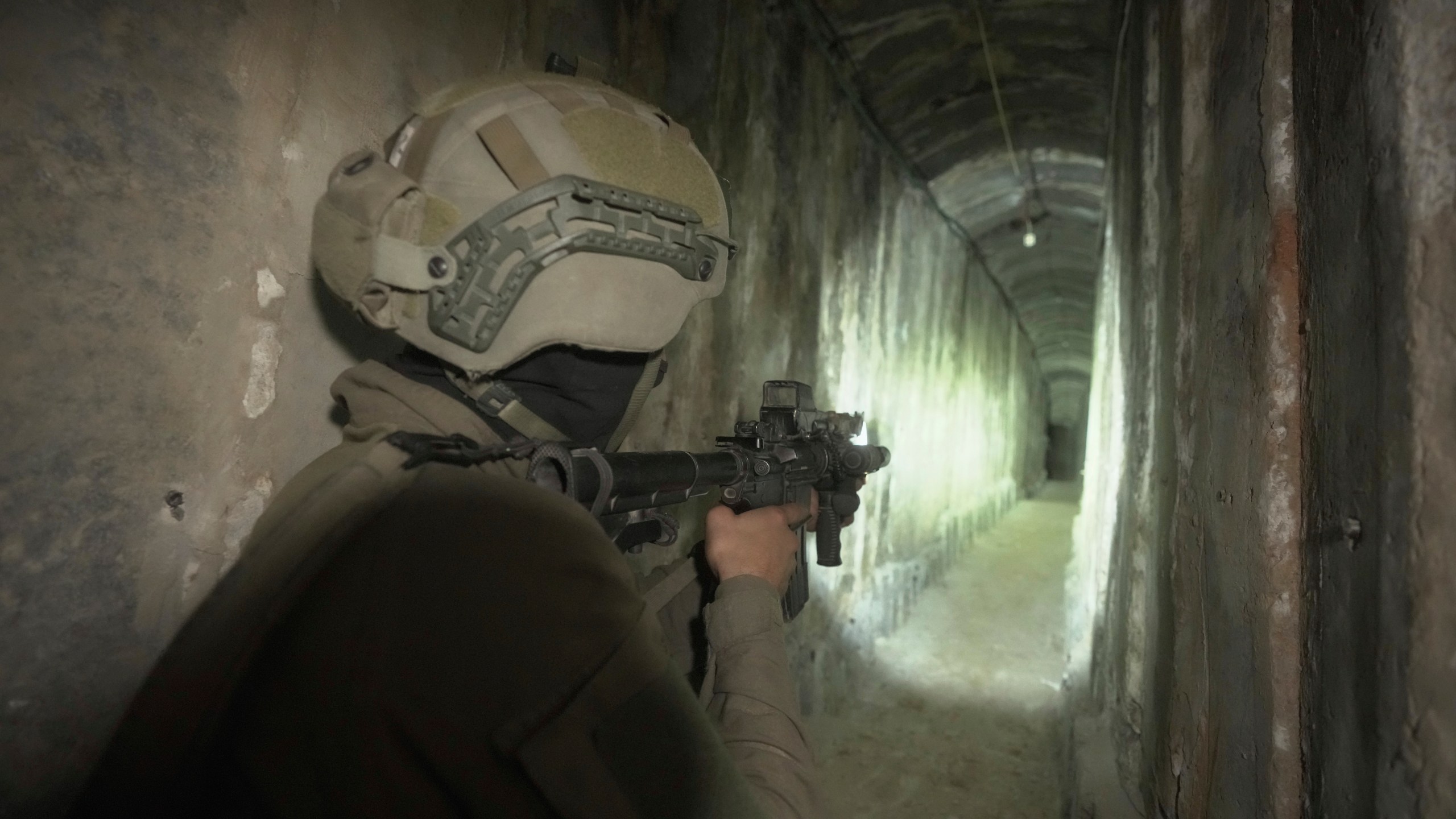 FILE - Israeli soldier shows the media an underground tunnel found underneath Shifa Hospital in Gaza City, Nov. 22, 2023. (AP Photo/Victor R. Caivano, File)