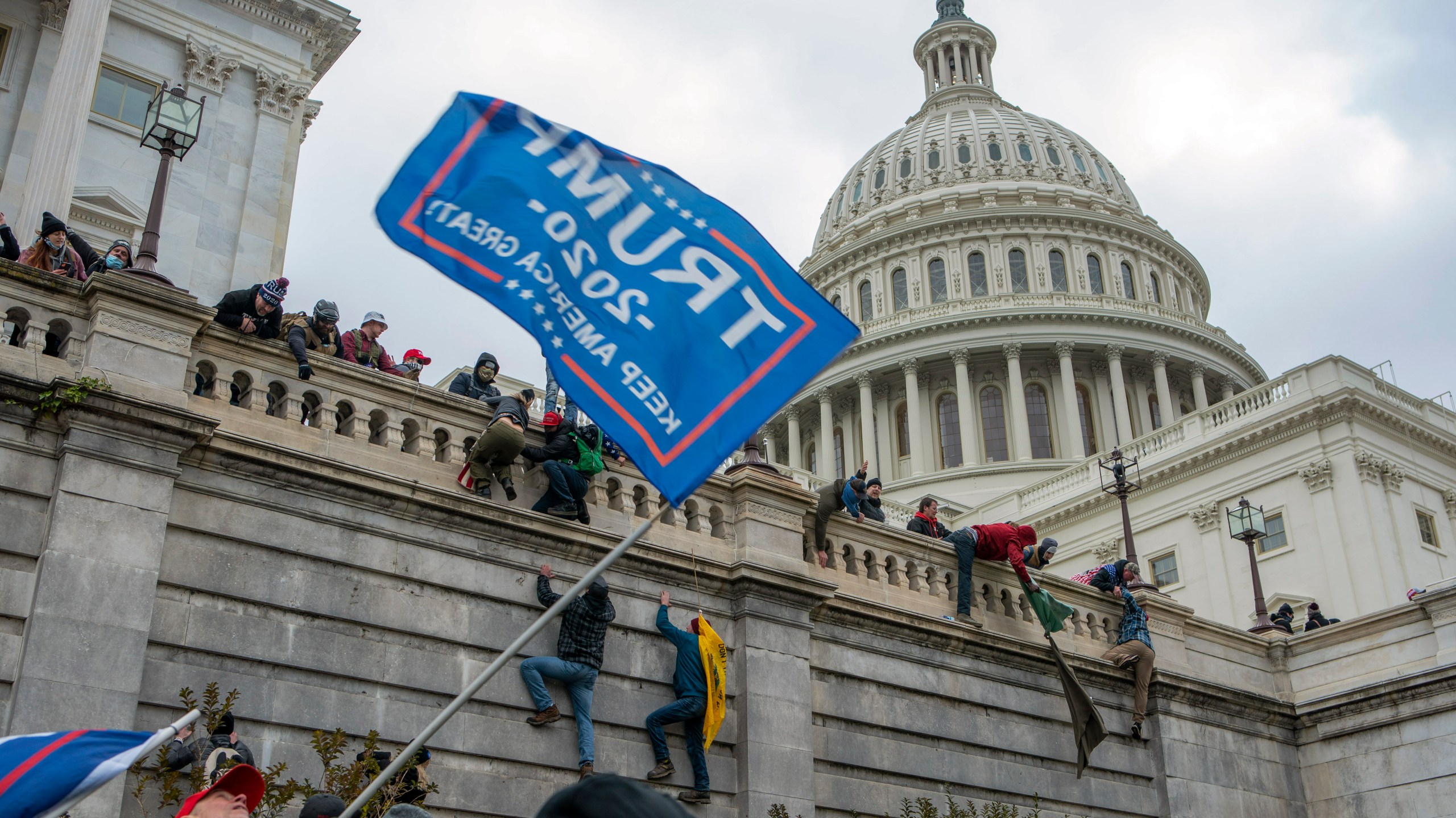 Supporters of Donald Trump climb the U.S. Capitol Jan. 6, 2021.