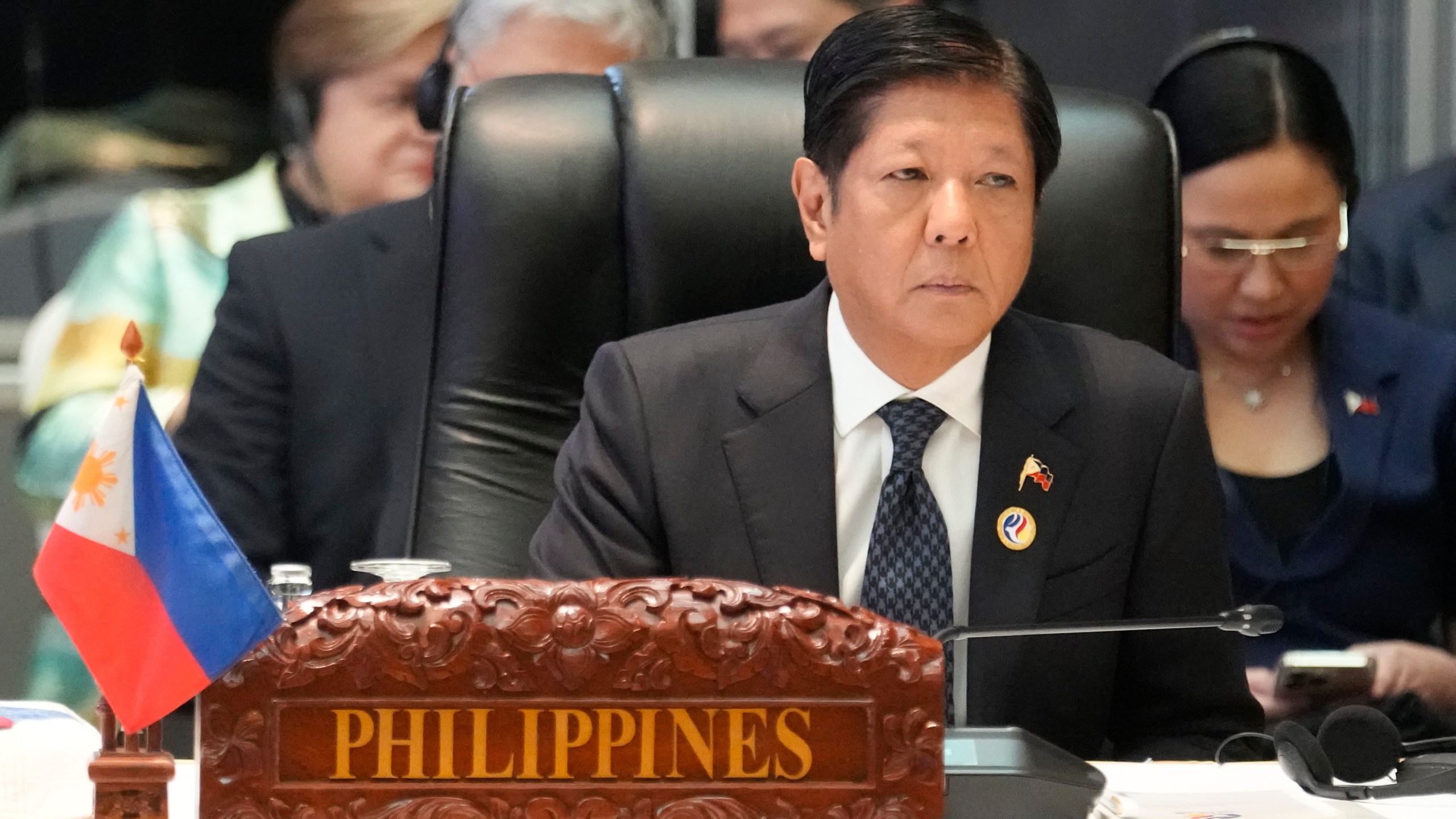 Philippine President Ferdinand Marcos Jr. listens from a podium