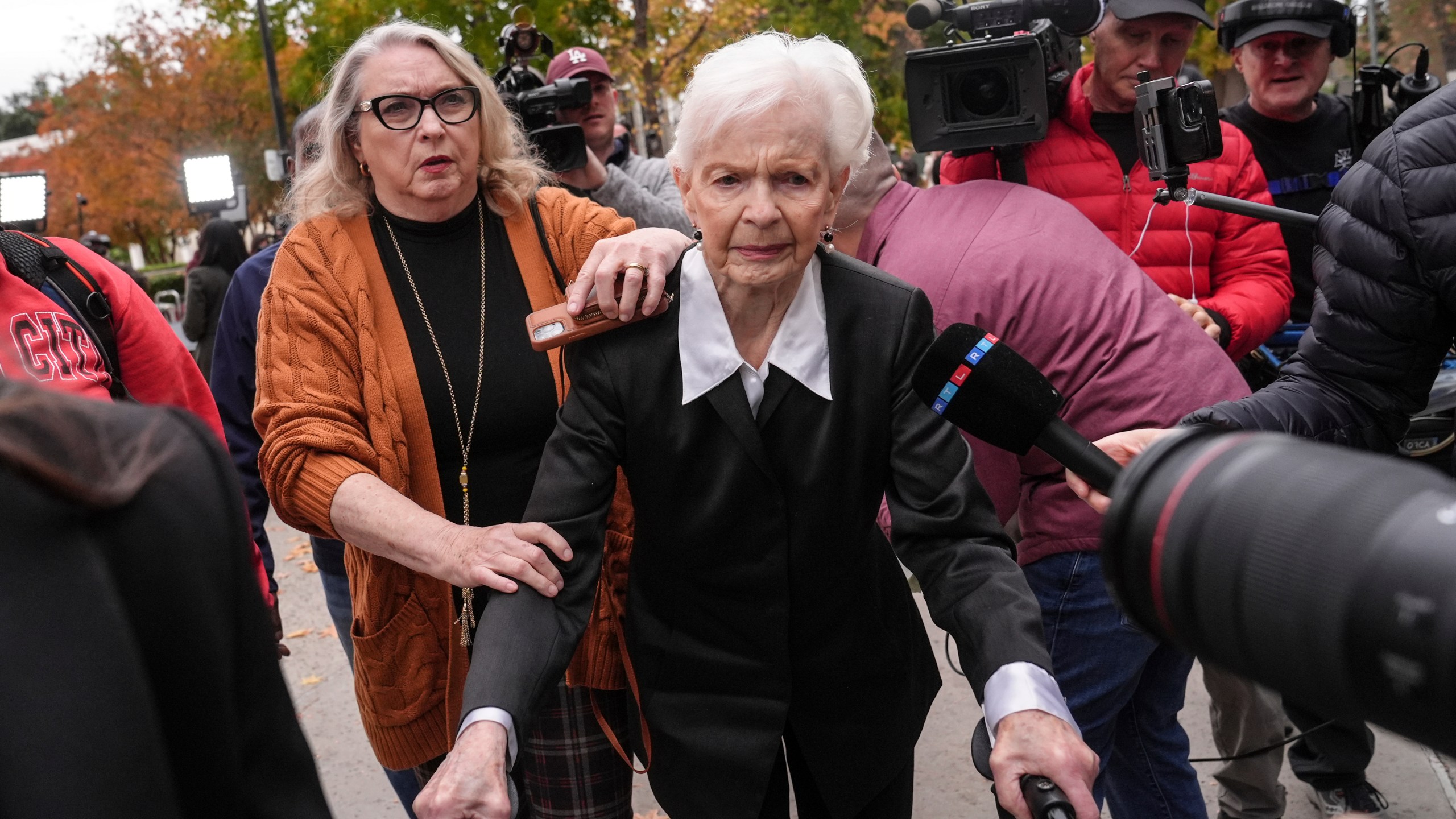 Erik and Lyle Menendez's aunt Joan VanderMolen, center, arrives at a courthouse to attend a hearing in Los Angeles, Monday, Nov. 25, 2024. (AP Photo/Jae C. Hong)