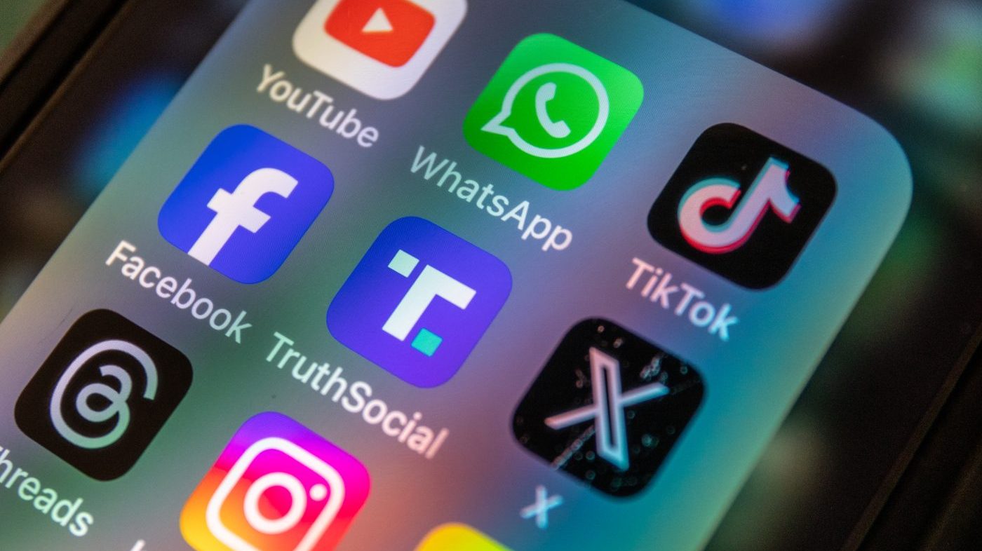 A smartphone screen displays various apps