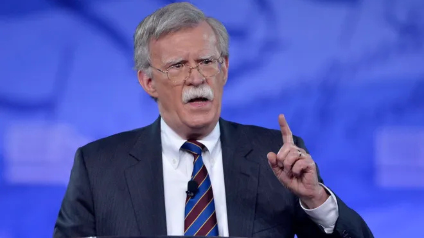 Former national security adviser John Bolton talks, raises finger