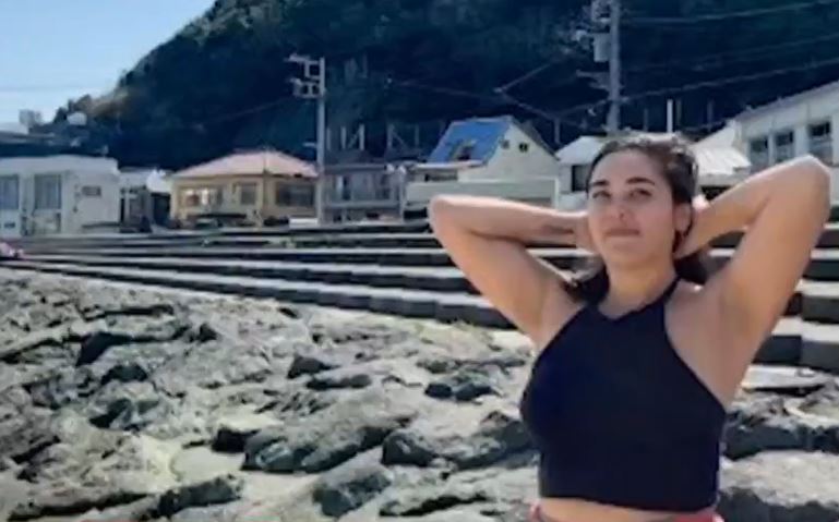 Hannah Kobayashi on a beach.