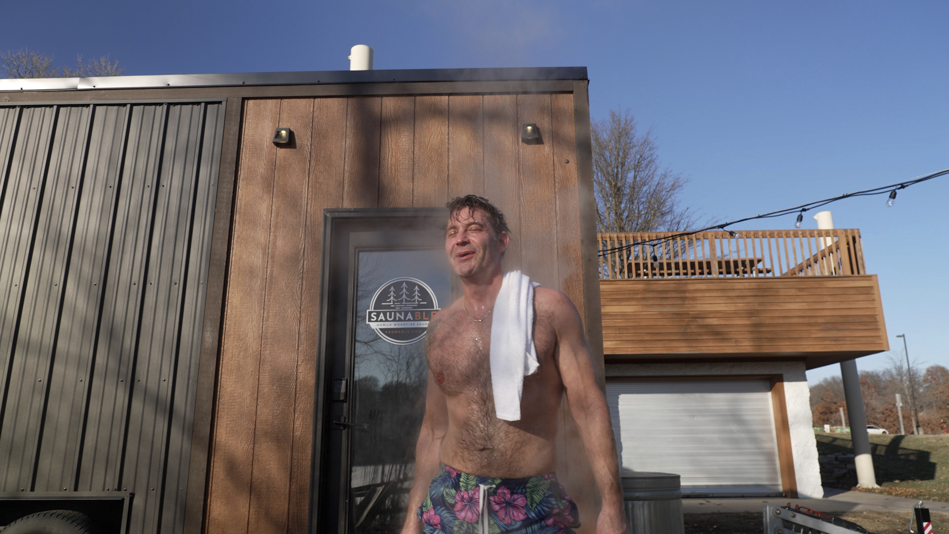 Man cools off after a session in a Saunable mobile sauna at Lebanon Hills Regional Park in Eagan, Minn., Sunday, Dec. 1, 2024.