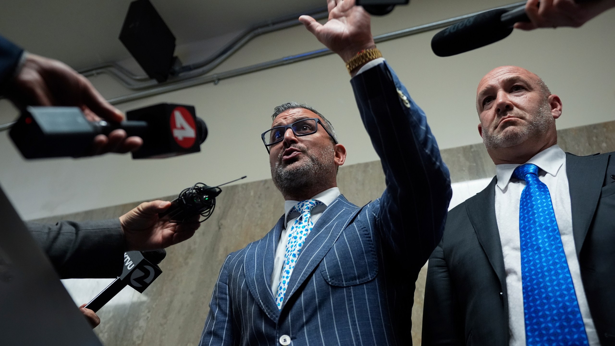 Defense attorneys Saam Zangeneh, center, and Bradford Cohen, right, speak to reporters after exiting the courtroom at the Hall of Justice for the murder trial of Nima Momeni, Tuesday, Dec. 3, 2024, in San Francisco. (AP Photo/Godofredo A. Vásquez)