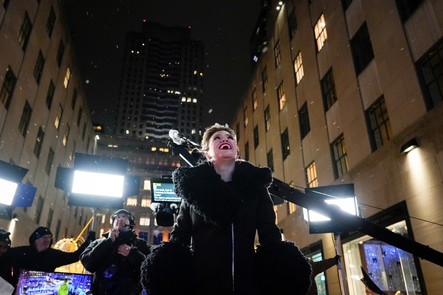 Kelly Clarkson reacts to snow during the 92nd annual Rockefeller Center Christmas tree lighting ceremony, Wednesday, Dec. 4, 2024, in New York. (AP Photo/Julia Demaree Nikhinson)
