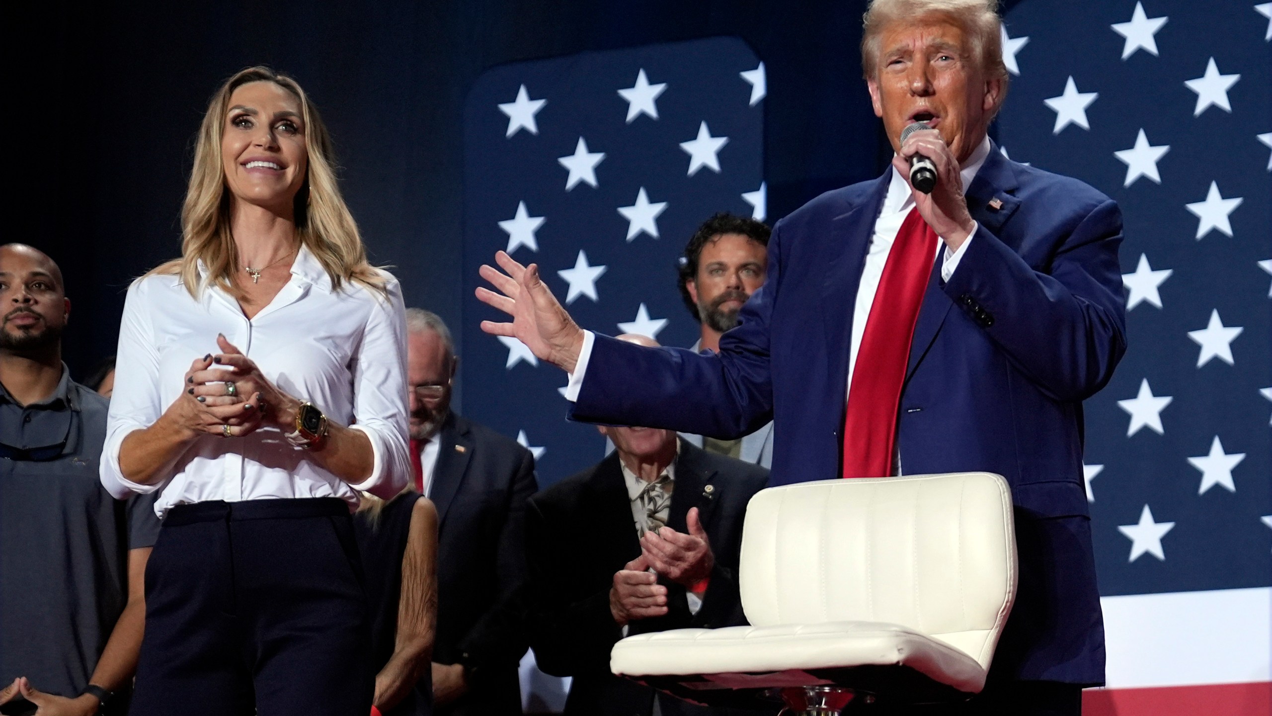 FILE - Republican presidential nominee former President Donald Trump speaks at a campaign town hall Oct. 4, 2024, in Fayetteville, N.C., as Republican National Committee co-chair Lara Trump listens. (AP Photo/Evan Vucci, File)