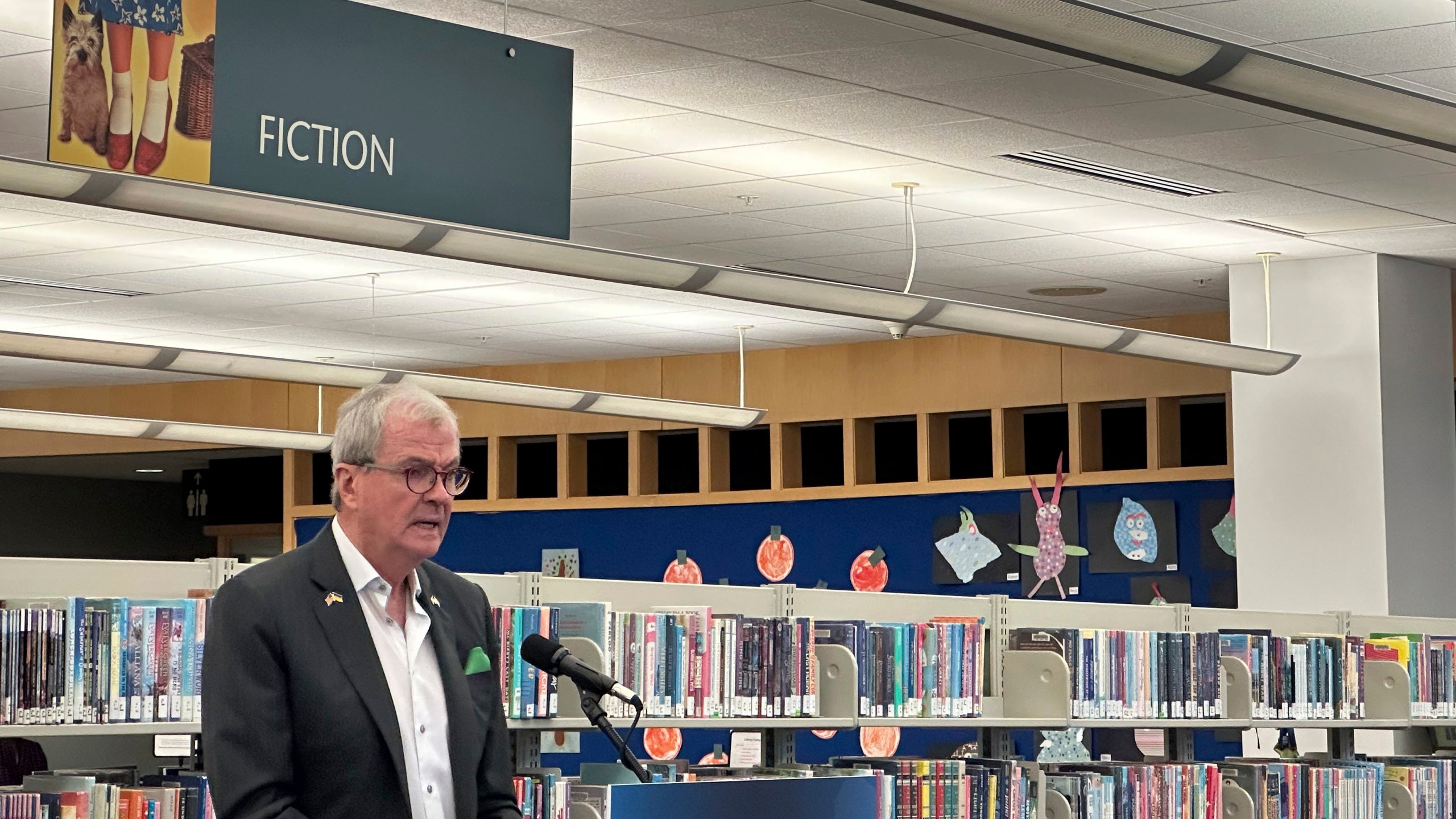 New Jersey Gov. Phil Murphy speaks at Princeton Public Library before signing legislation aimed at prohibiting school and public libraries from banning books in the state on Monday, Dec. 9, 2024. (AP Photo/Mike Catalini)
