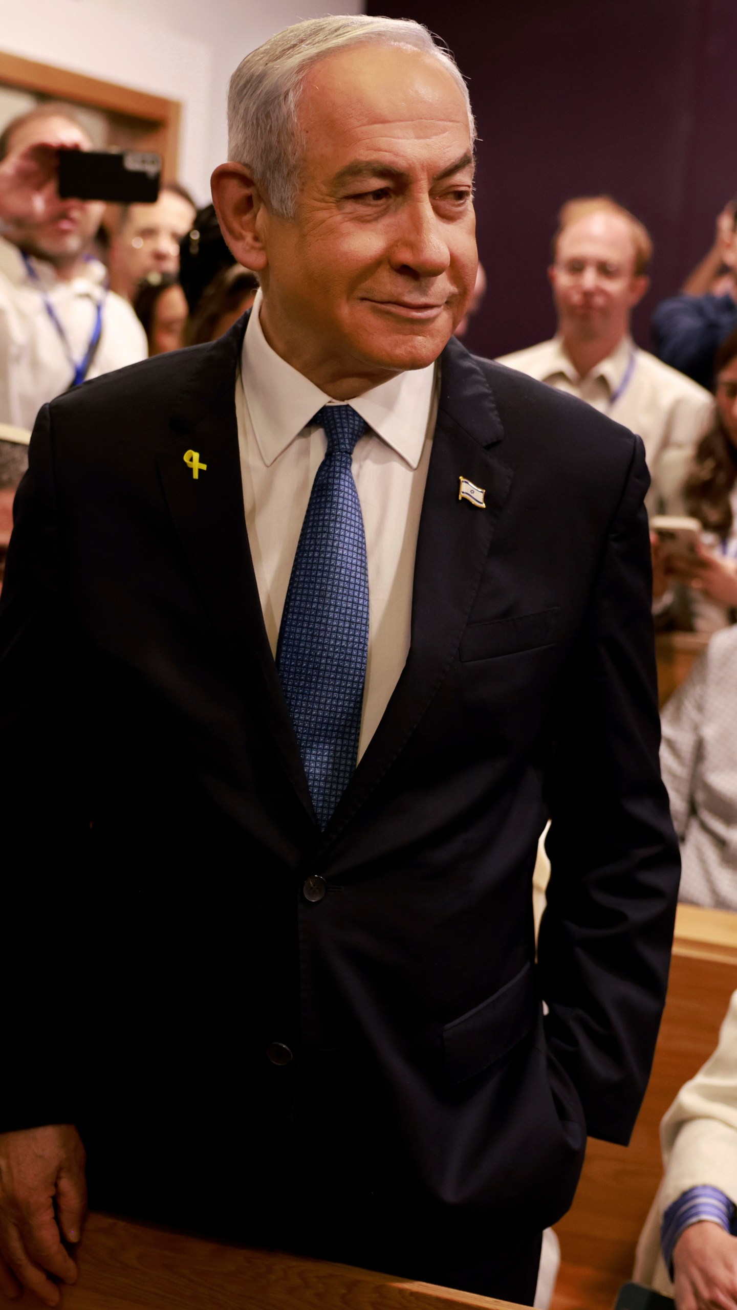 Israeli Prime Minister Benjamin Netanyahu arrives at the district court for his long-running trial for alleged corruption, in Tel Aviv, Israel, Tuesday, Dec. 10, 2024. (Menahem Kahana/Pool Photo via AP)