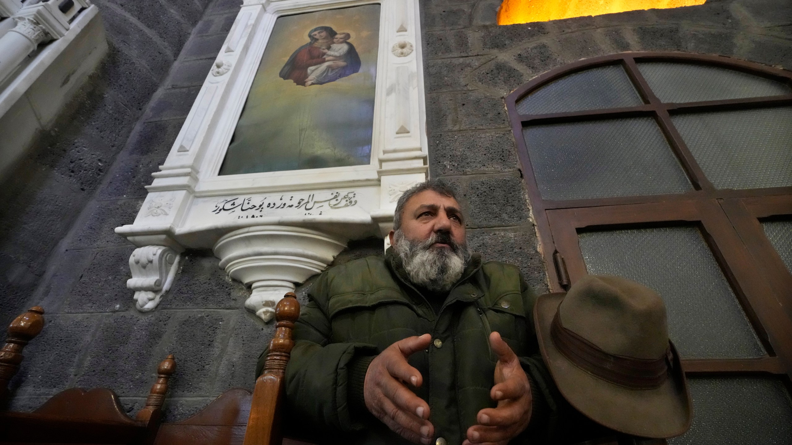A Syrian Christians man prays during the first Sunday Mass since Syrian President Bashar Assad's ouster, at Mariamiya Orthodox Church in old Damascus, Syria, Sunday, Dec. 15, 2024. (AP Photo/Hussein Malla)
