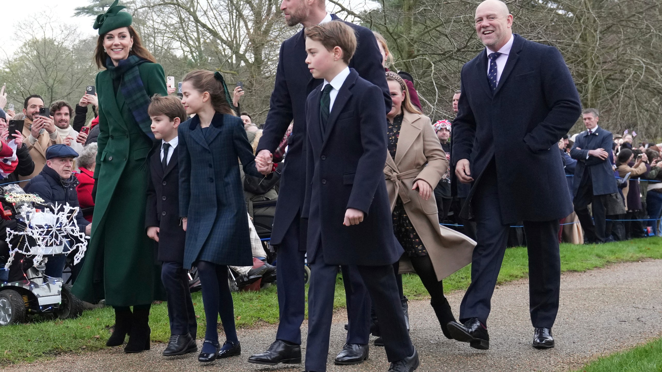 Kate, Princess of Wales, left, with Prince Louis, Princess Charlotte, Prince William and Prince George arrive for the Christmas day service at St Mary Magdalene Church in Sandringham in Norfolk, England, Wednesday, Dec. 25, 2024, at right, is Mike Tyndall husband of Zara Phillips. (AP Photo/Jon Super)