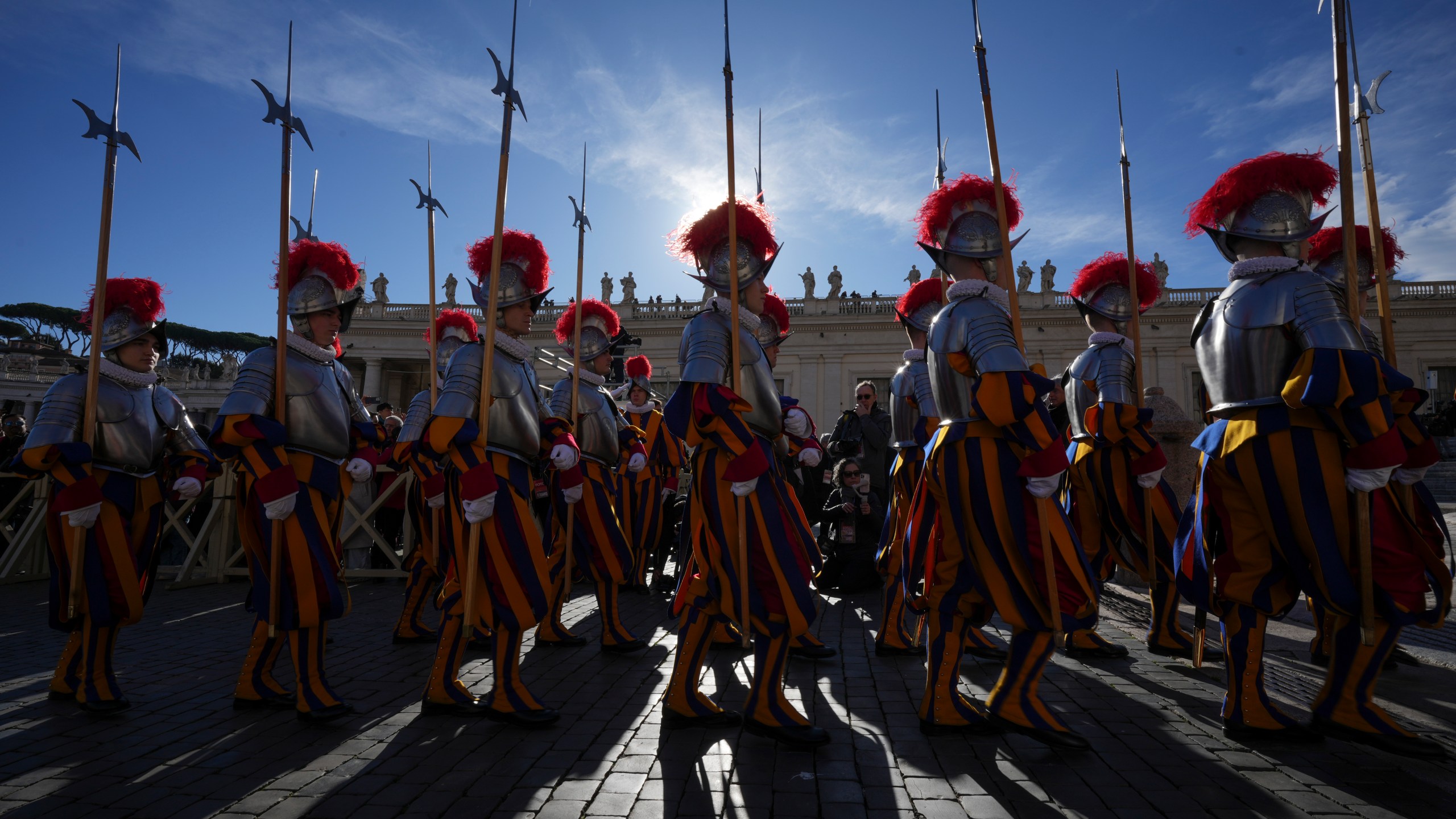 Swiss Guards march in front of St. Peter's Basilica at the Vatican, Wednesday, Dec. 25, 2024. (AP Photo/Andrew Medichini)