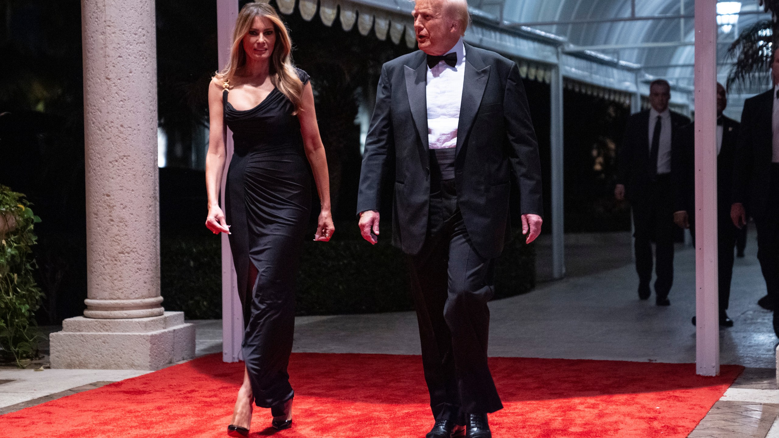 Melania Trump looks on as President-elect Donald Trump arrives for a New Year's Eve party at Mar-a-Lago, Tuesday, Dec. 31, 2024, in Palm Beach, Fla. (AP Photo/Evan Vucci)
