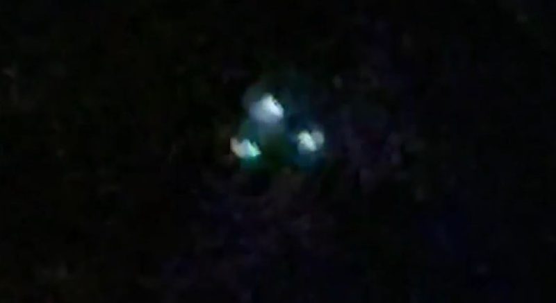 A drone is seen in the night sky.