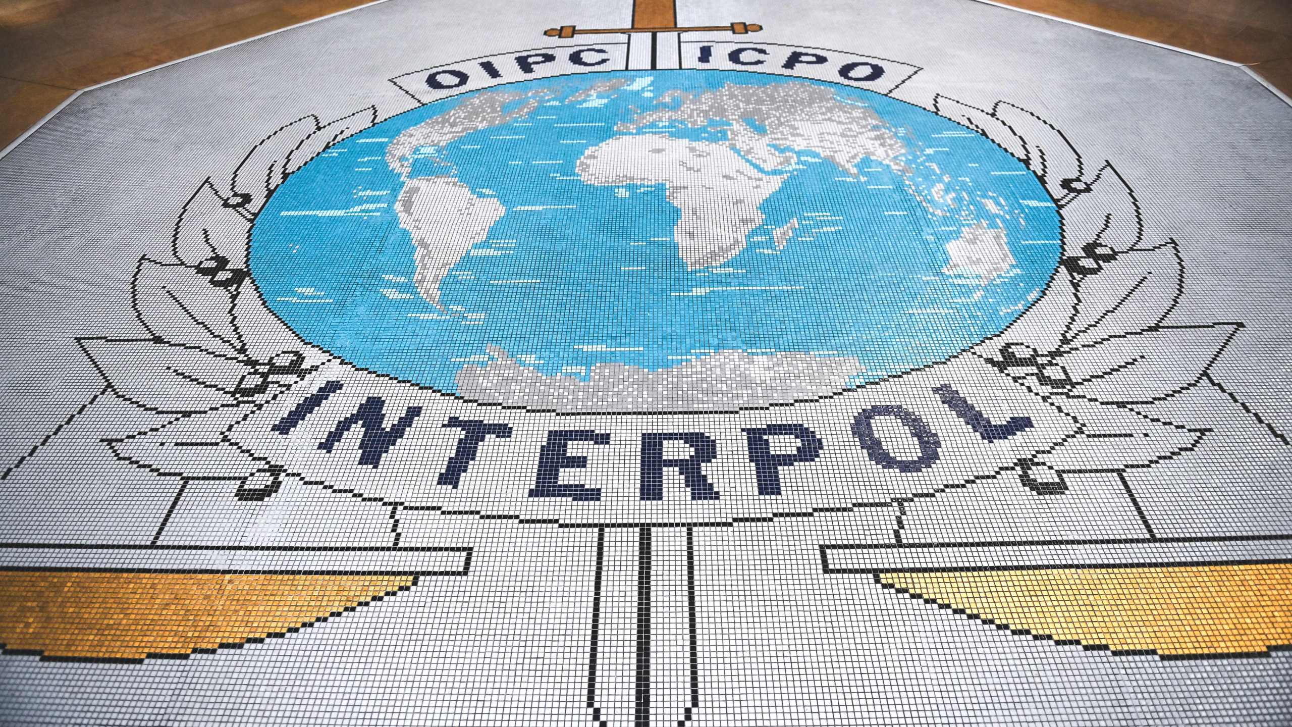 The logo of the International Criminal Police Organization, known as Interpol.