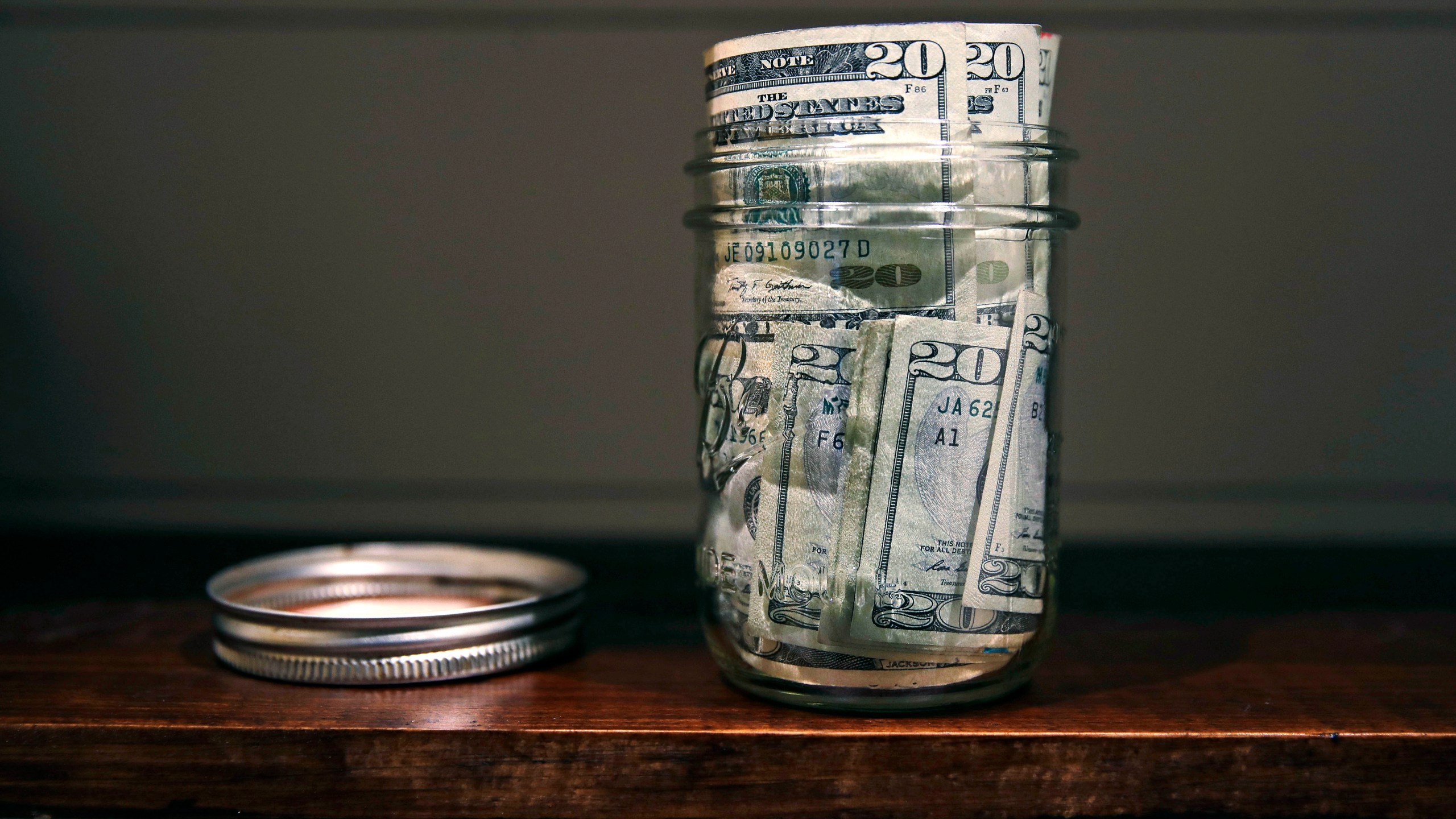 A canning jar filled with money