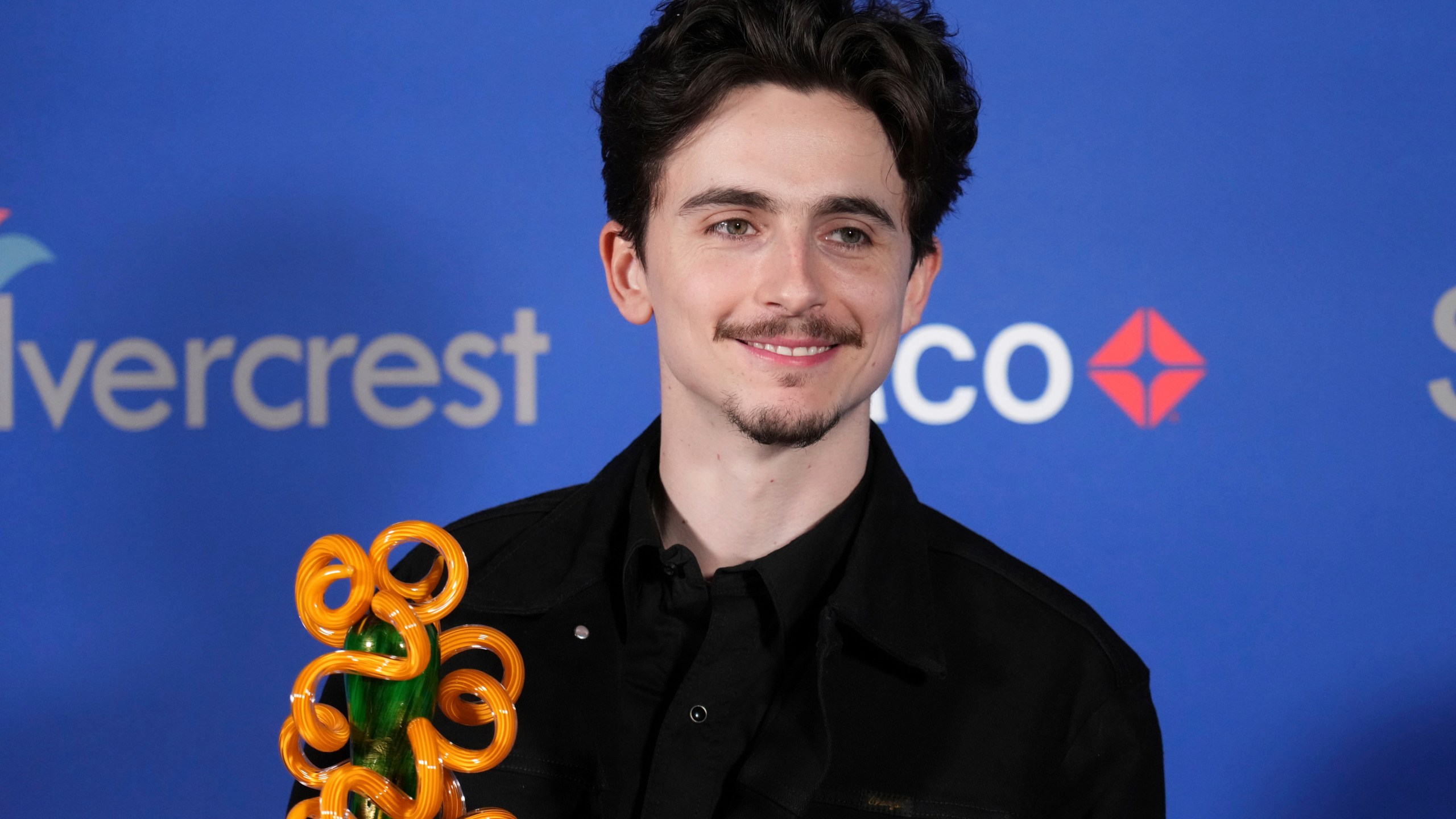 Timothee Chalamet poses with the chairman's award for "A Complete Unknown" in the press room during the 36th annual Palm Springs International Film Festival Awards Gala on Friday, Jan. 3, 2025, in Palm Springs, Calif. (Photo by Jordan Strauss/Invision/AP)