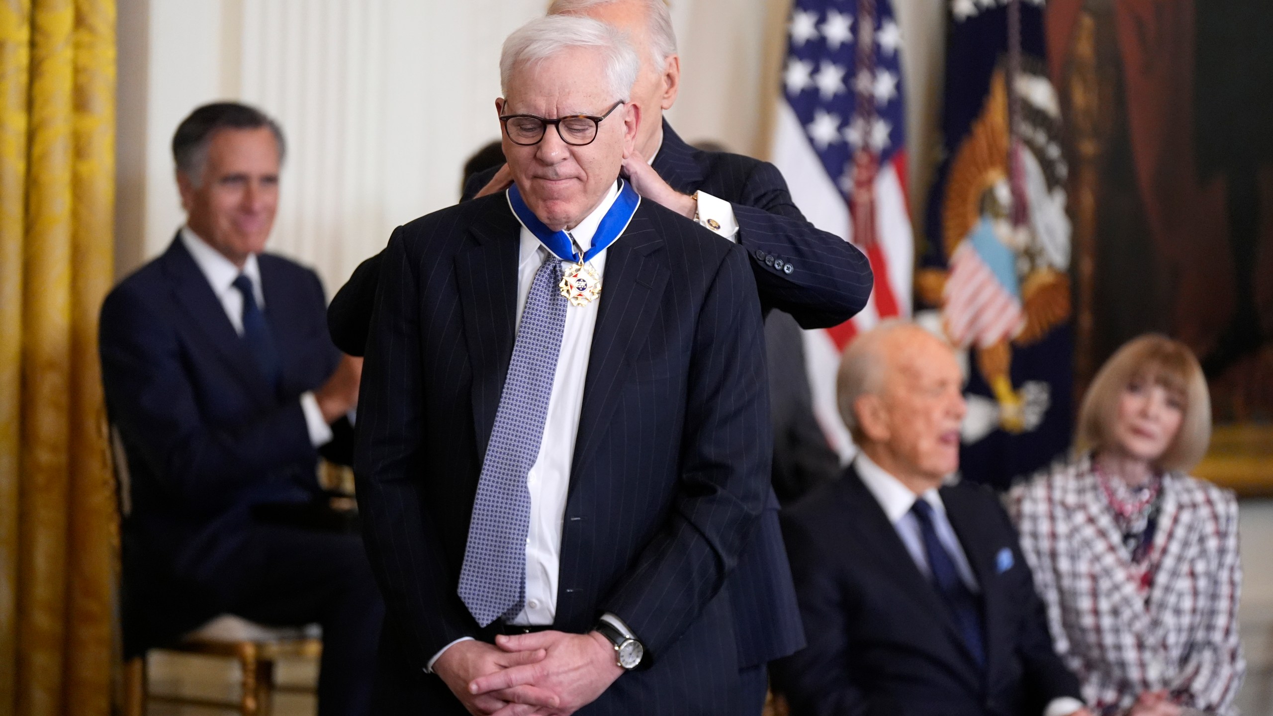 President Joe Biden, right, presents the Presidential Medal of Freedom, the Nation's highest civilian honor, to David Rubenstein in the East Room of the White House, Saturday, Jan. 4, 2025, in Washington. (AP Photo/Manuel Balce Ceneta)