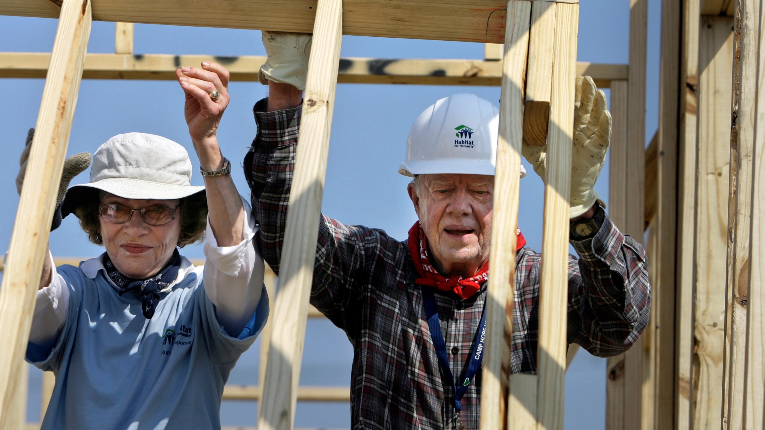 FILE - Former President Jimmy Carter, right, and former first lady Rosalynn Carter help build a Habitat for Humanity house in Violet, La., May 21, 2007. The pair were working on the 1,000th Habitat for Humanity house in the Gulf Coast region since hurricanes Katrina and Rita. (AP Photo/Alex Brandon, File)