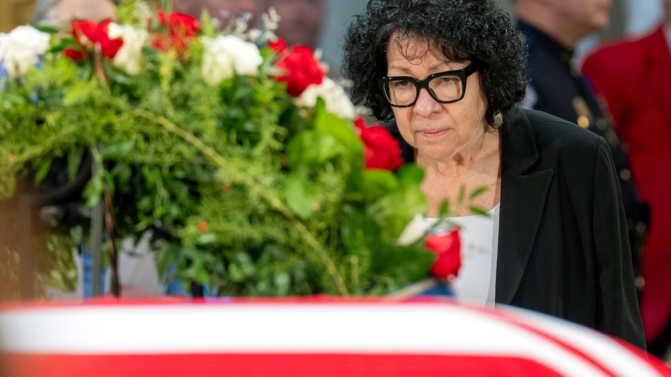 Supreme Court Associate Justice Sonia Sotomayor pays her respects at the side of the flag-draped casket of former President Jimmy Carter as he lies in state in the Capitol, Wednesday, Jan. 8, 2025, in Washington. (AP Photo/Jacquelyn Martin)