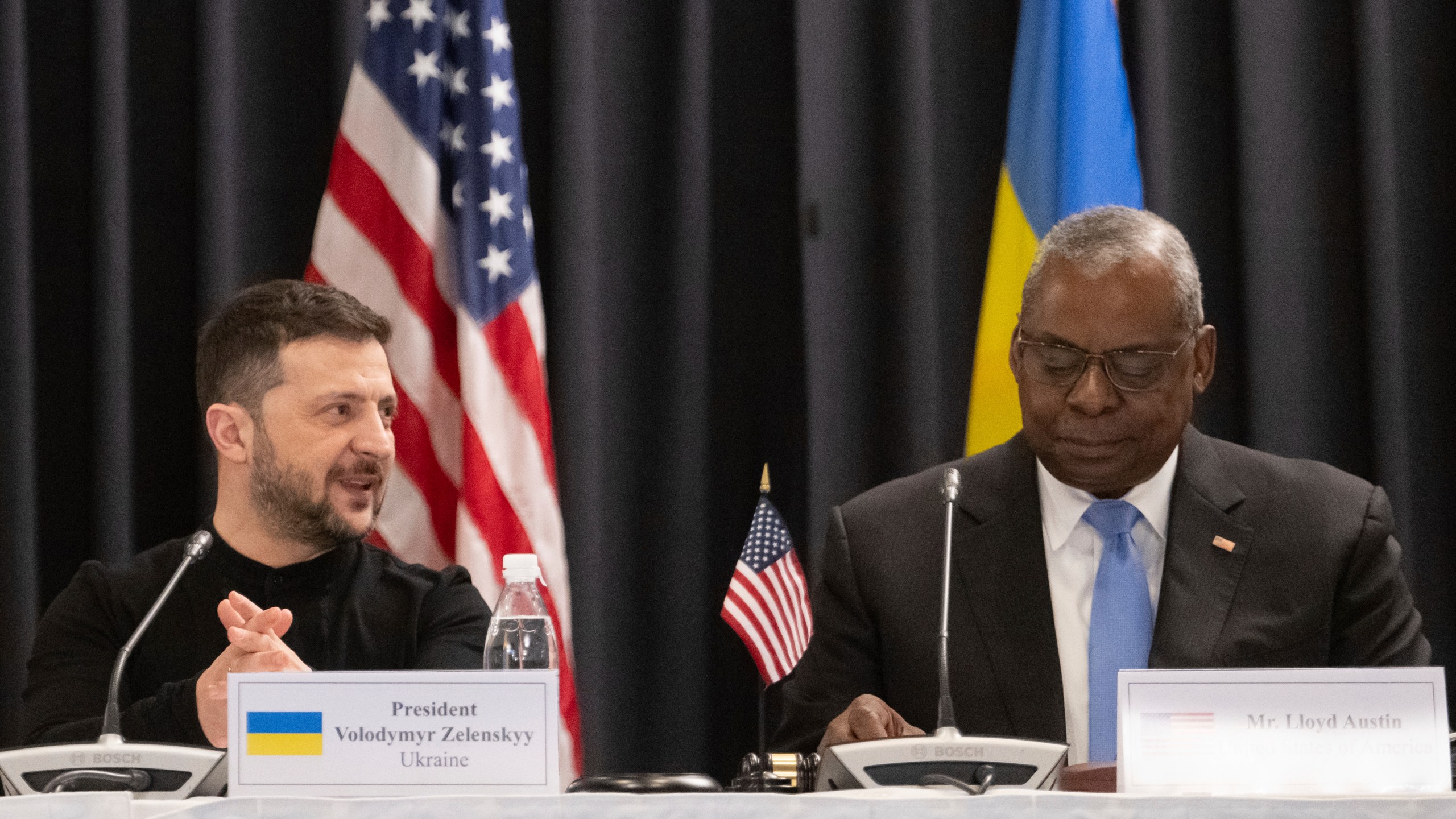 U.S. Secretary of Defense Lloyd Austin, right, and Ukrainian President Volodymyr Zelenskyy attend a meeting of the Ukraine Contact Group at Ramstein Air Base, Germany, Thursday, Jan. 9, 2025. (Marijan Murat/dpa via AP)