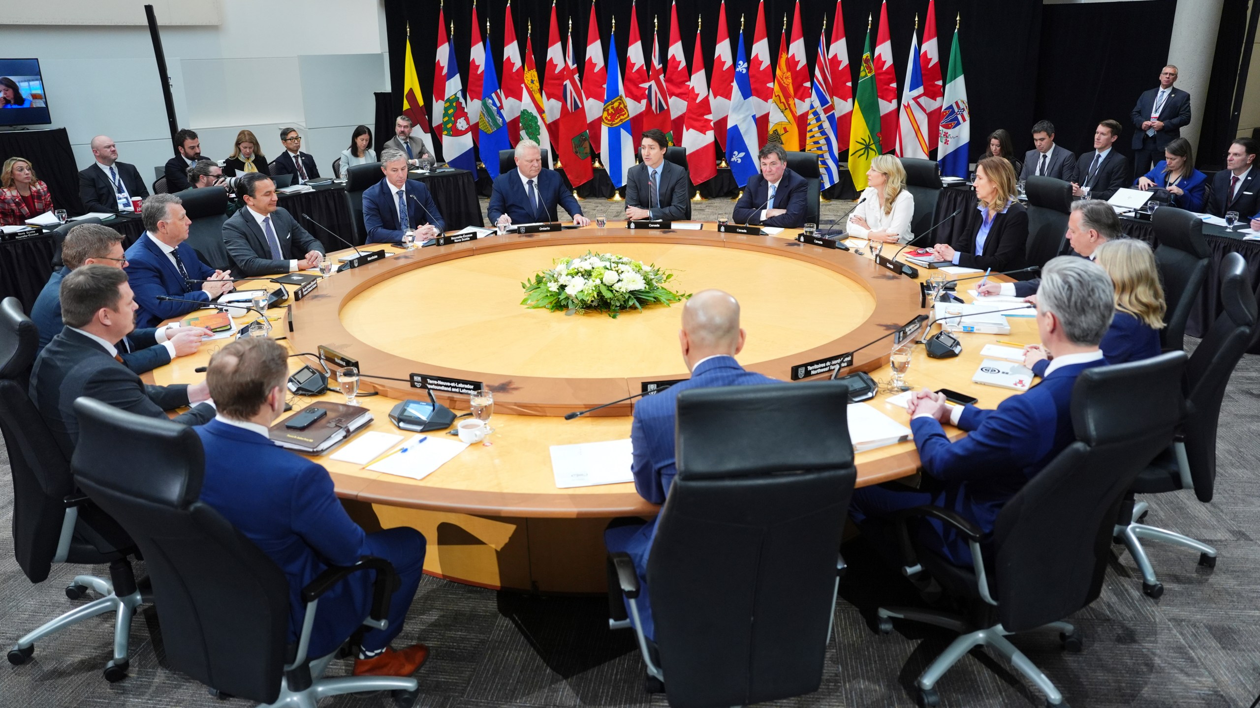 Canada Prime Minister Justin Trudeau, back center, premiers and cabinet ministers attend the first ministers meeting in Ottawa on Wednesday, Jan. 15, 2025. (Sean Kilpatrick/The Canadian Press via AP)